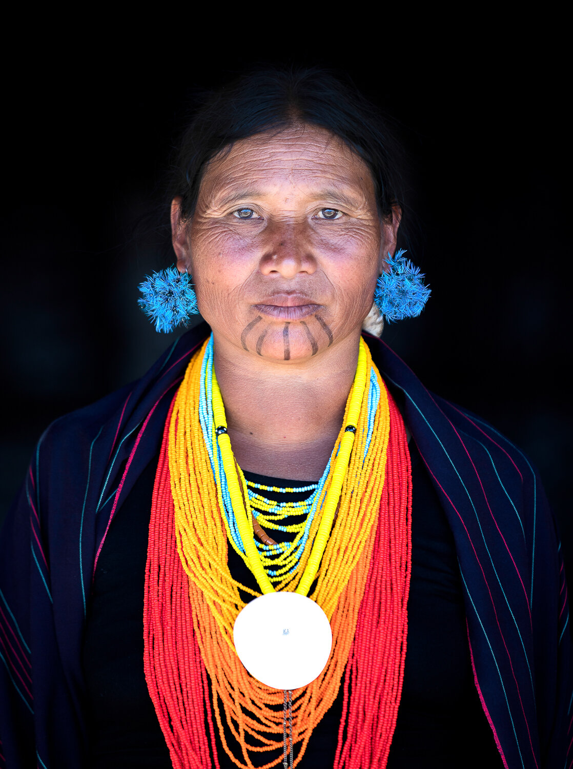 portrait of traditional old woman in tribal attire during hornbill festival in Nagaland