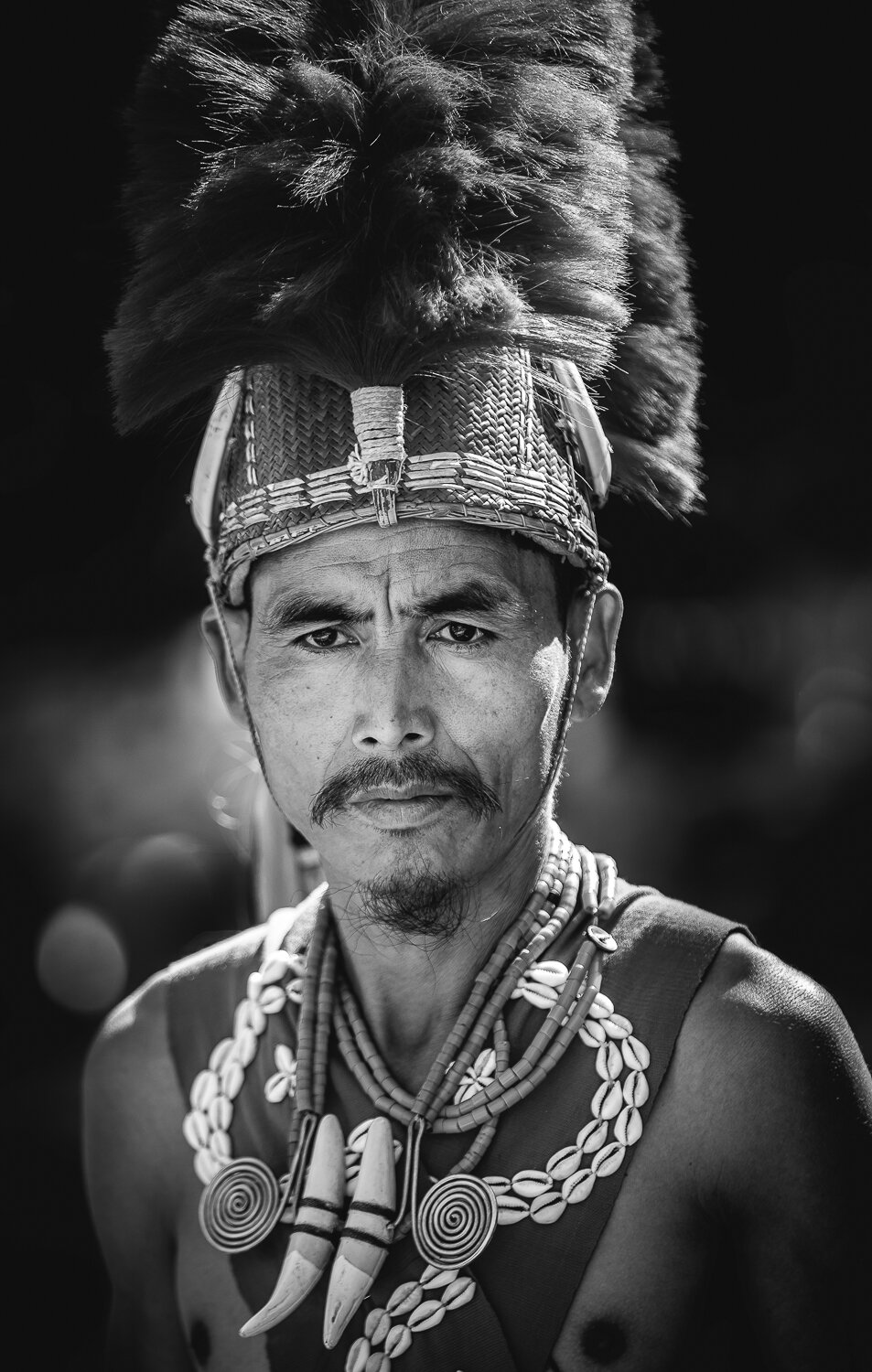 naga tribal warrior portrait during hornbill festival in black and white