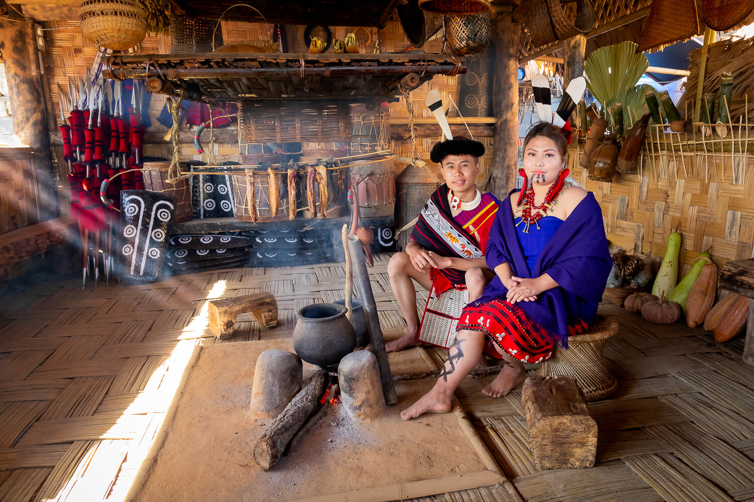 young couple of AO tribe from nagaland showcasing lifestyle of community during hornbill festival at kisama heritage village nagaland