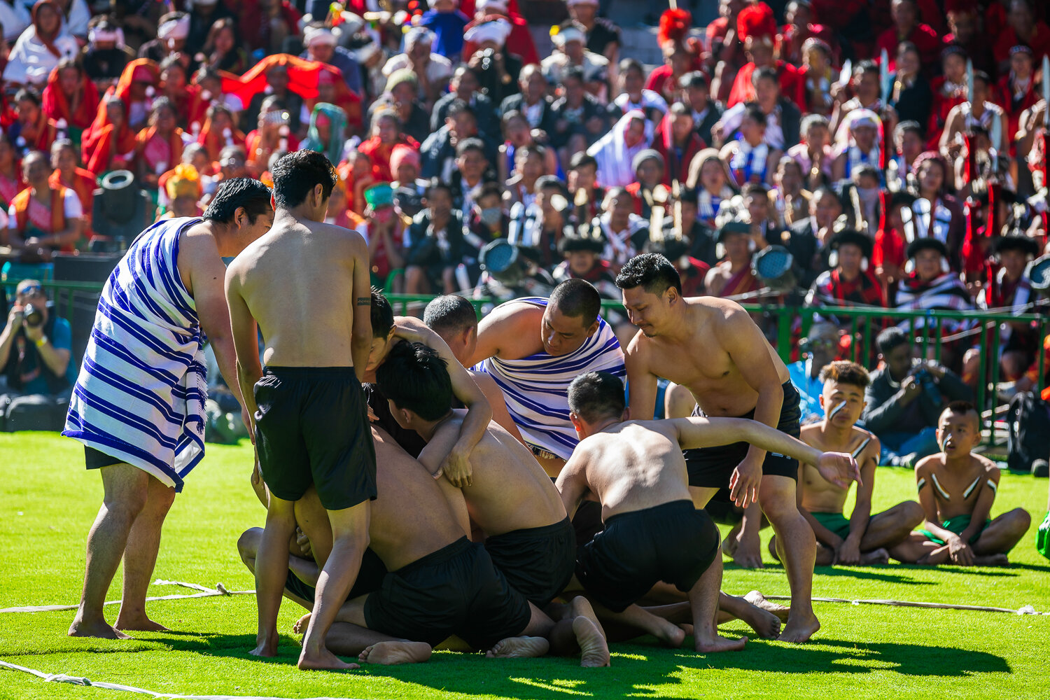 naga tribe showcasing traditional game of hekko during hornbill festival in nagaland