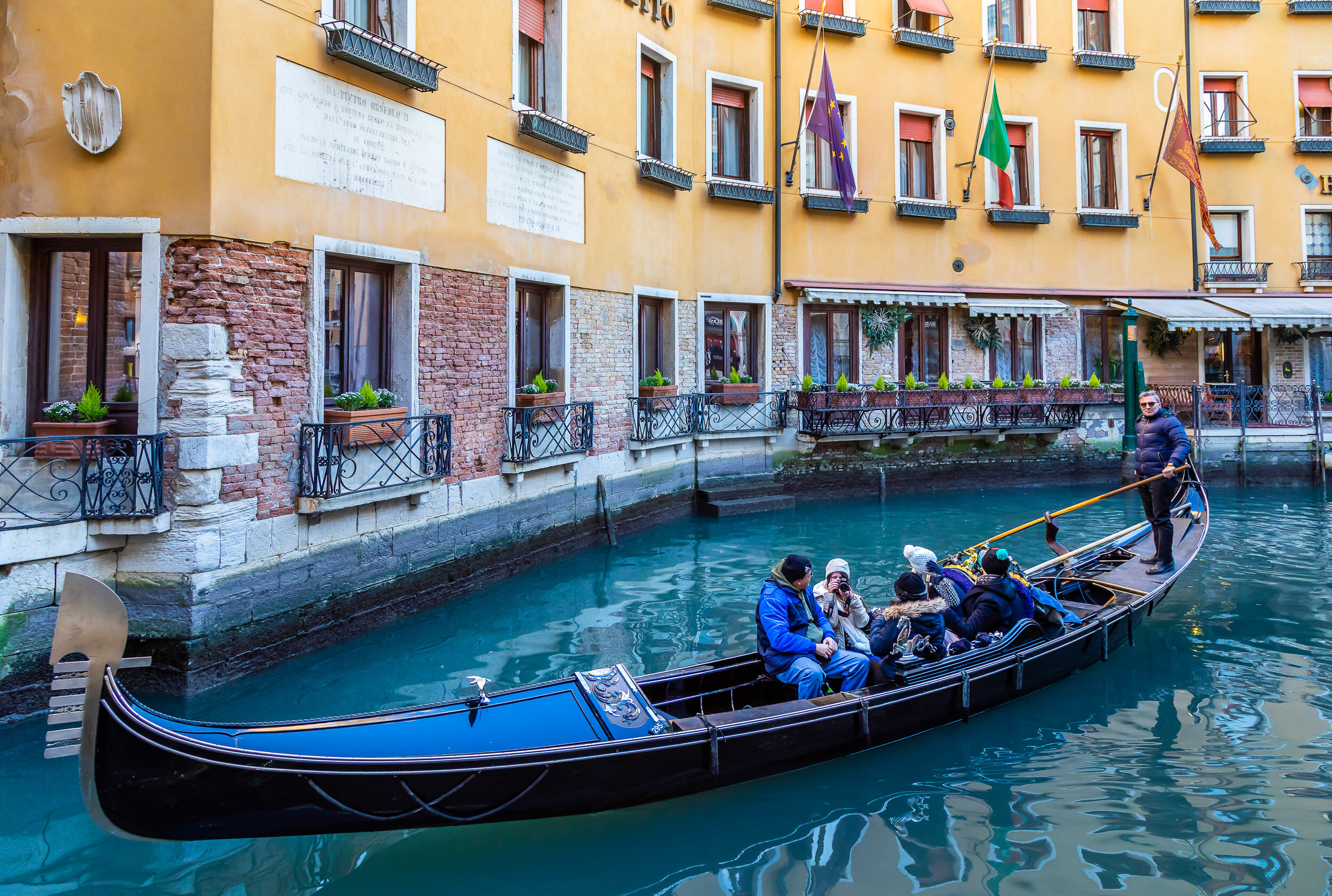 Travellers on Gondola ride in Venice