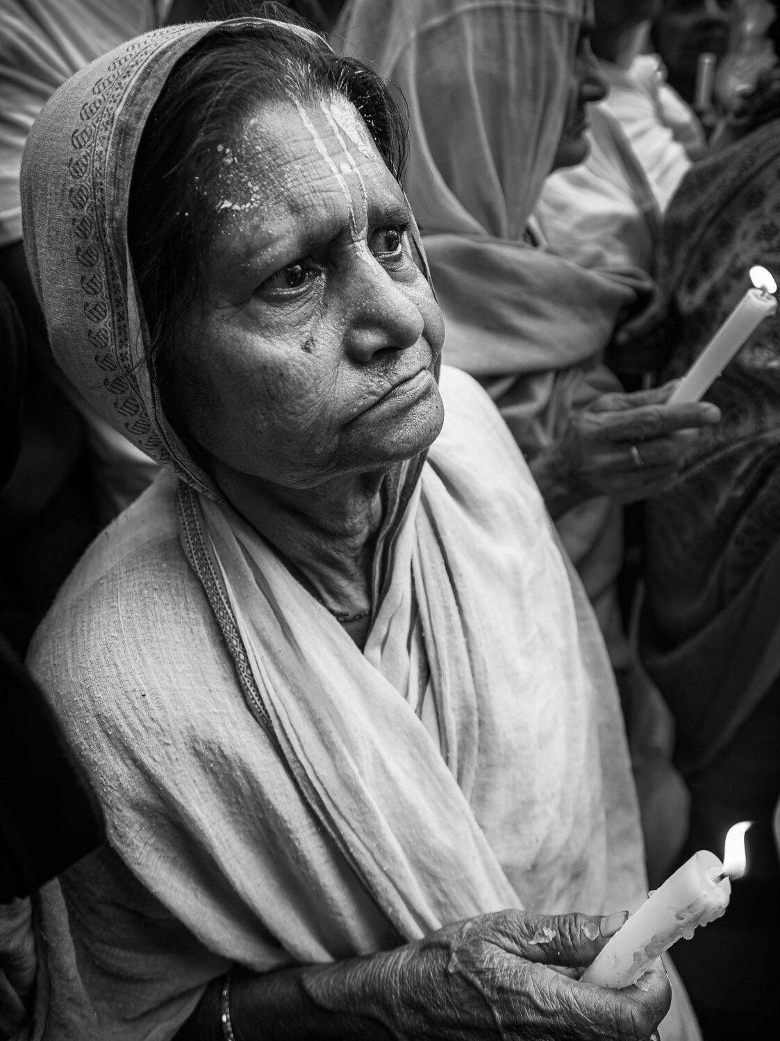 widow of vrindavan with candle by prathamesh dixit.jpg