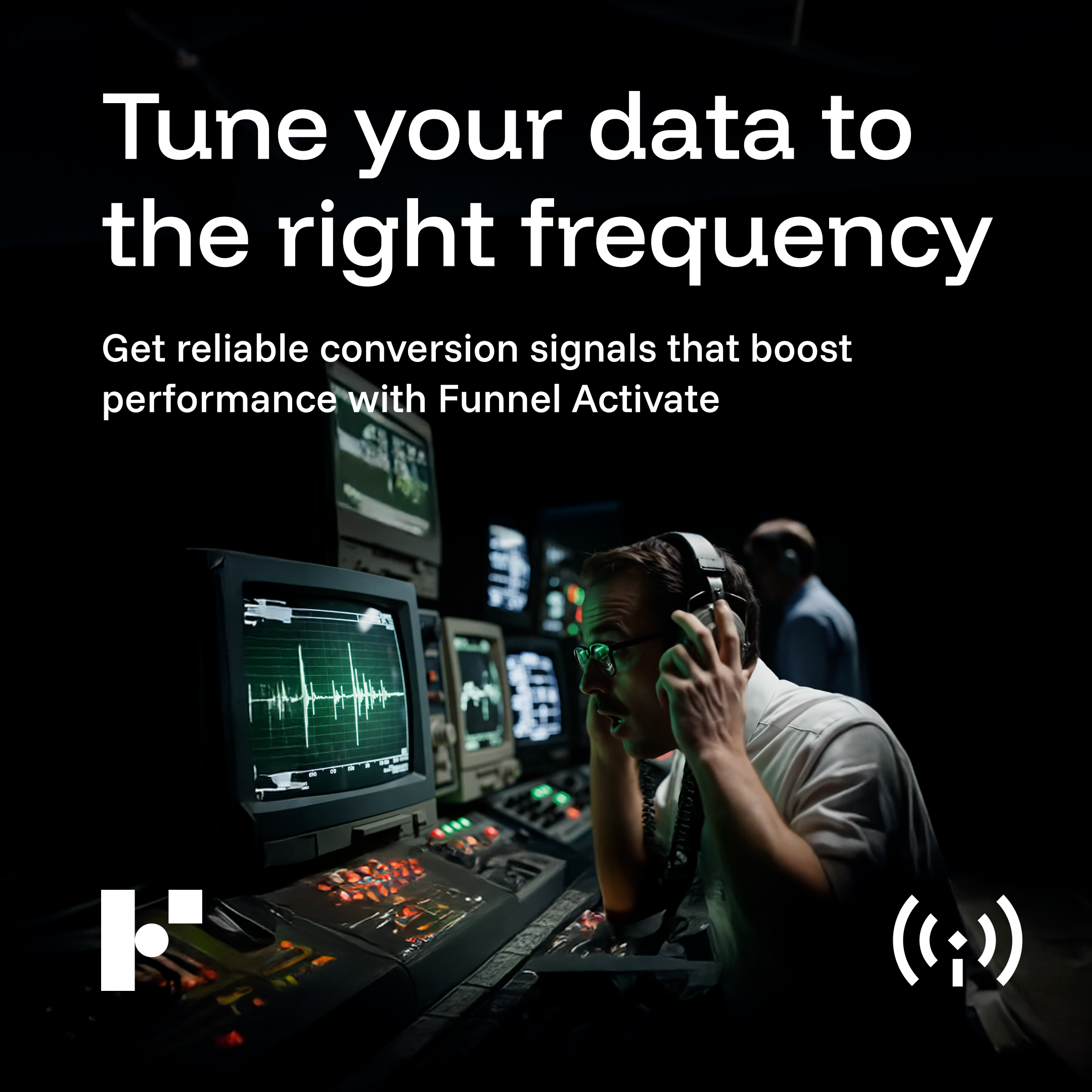Man wearing headphones working on multiple monitors in a dark control room with audio waveforms