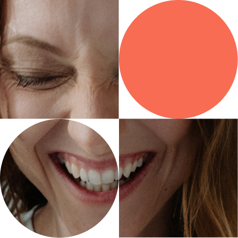 Close-up of smiling women, with visible teeth and eyes closed, showing joy and happiness.