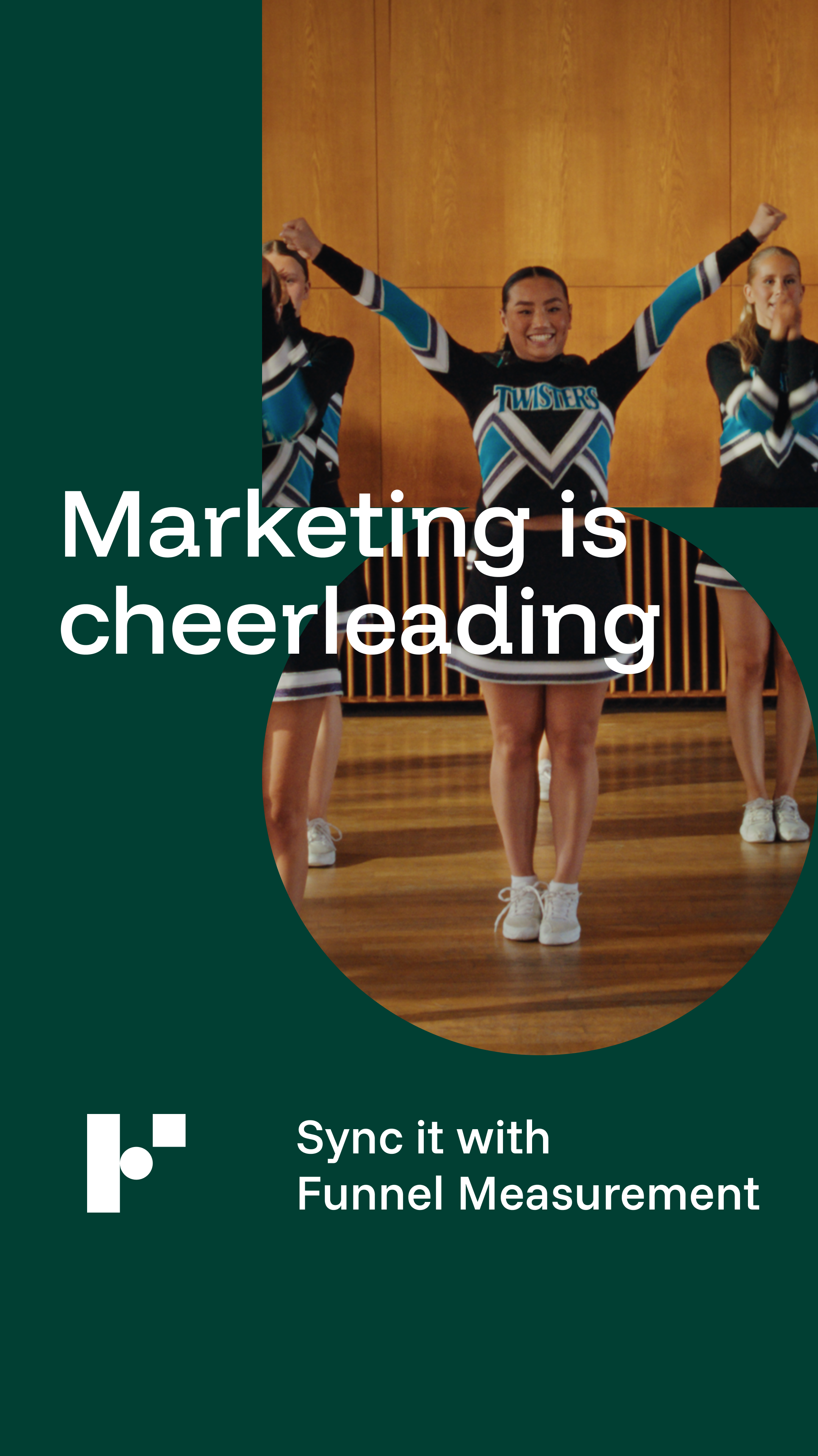 Cheerleaders in cheerleading uniforms, smiling with arms raised, in a gym or auditorium.