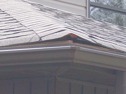 Damaged Framing Under Roof Decking Creates Opening Into Attic