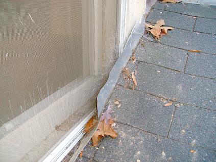 Roof To Poorly Designed Addition Creates A Dam In The Window Seal And Will Continually Allow Rain Into Wall And Interior Of Home in Homewood