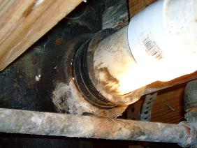 Missing Clamp Causes Waste Line To Leak In Crawlspace in Birmingham Home