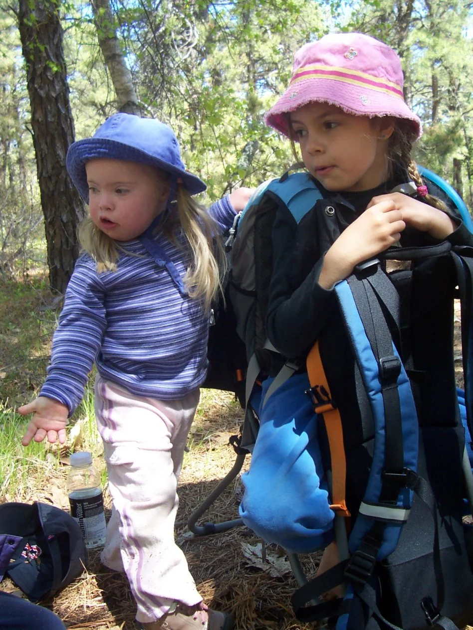 NH Tal standing Little with T backpack.jpg