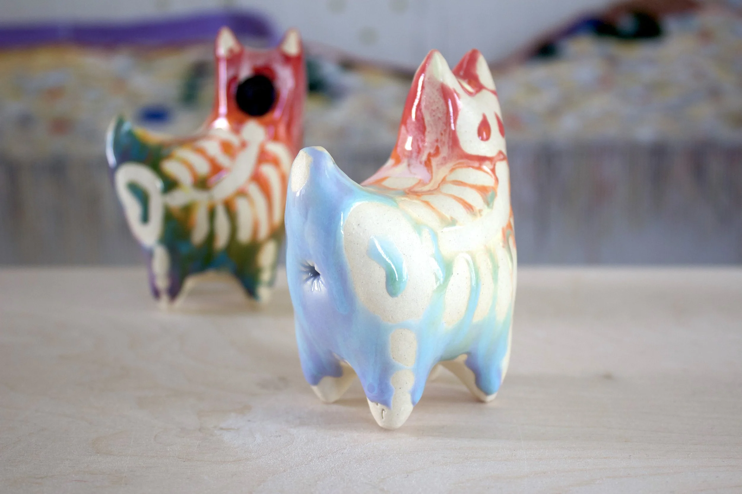 One-of-a-kind handmade large ceramic Pastel Rainbow Goo Skeleton Cat viewed from the front.jpeg