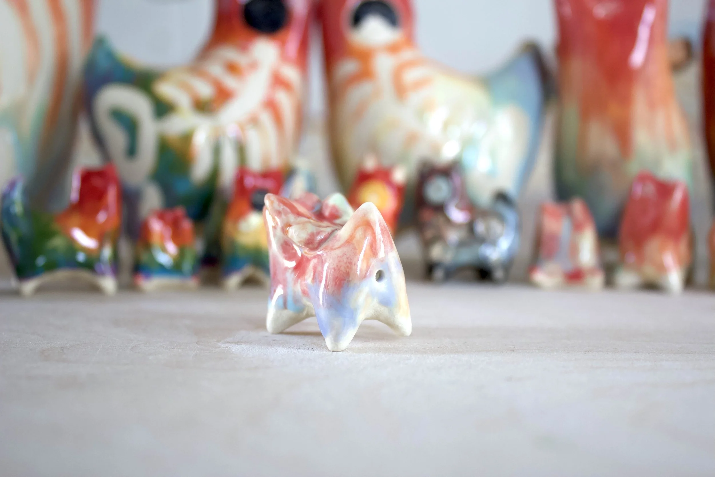 Back view of the Pastel Rainbow Butterfly Cat showing sculpted pastel rainbow butterfly details.jpeg