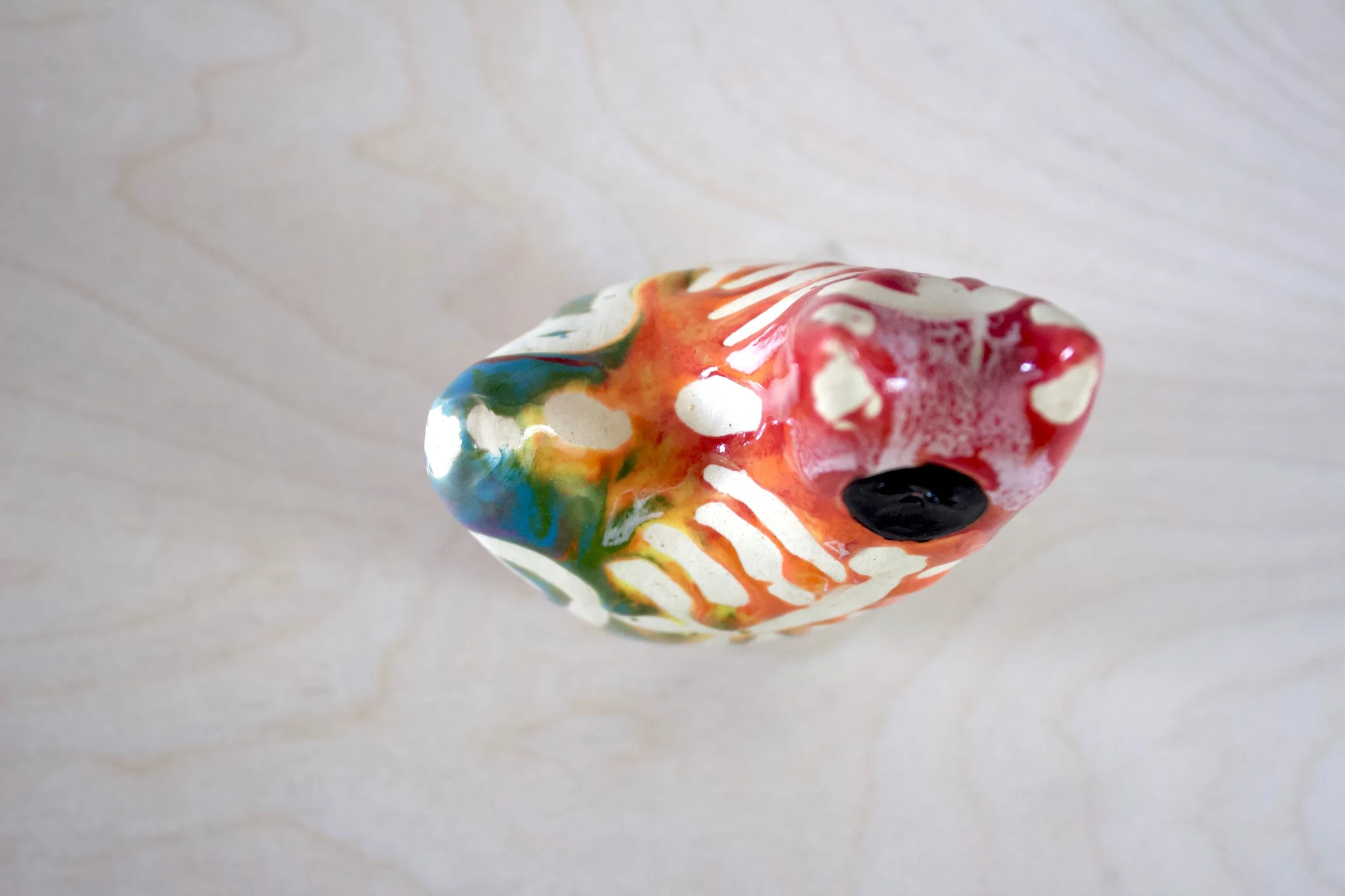 Top view of the large Rainbow Goo Skeleton Black Cat showing sculpted rainbow goo and skeleton details.jpeg