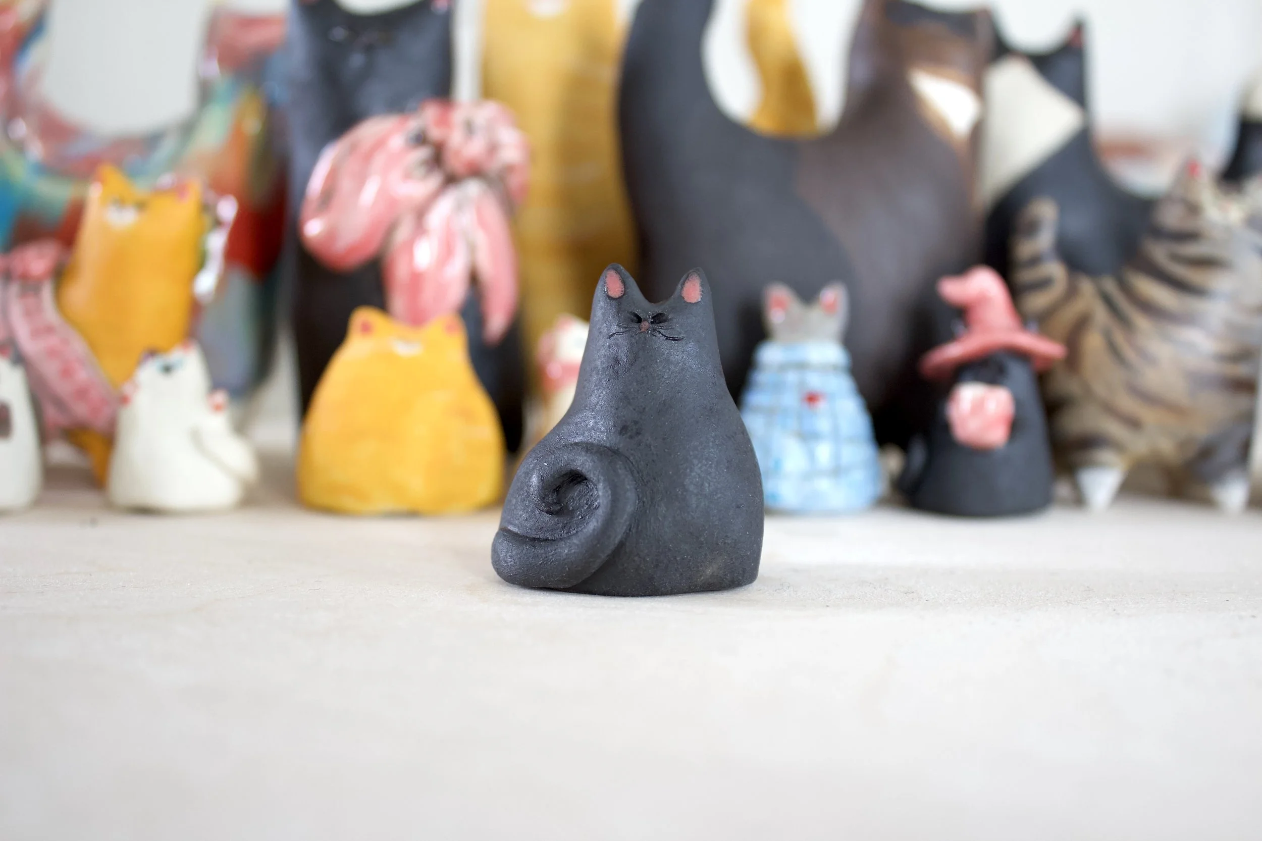 Void handmade black ceramic cat chime sculpture.jpeg