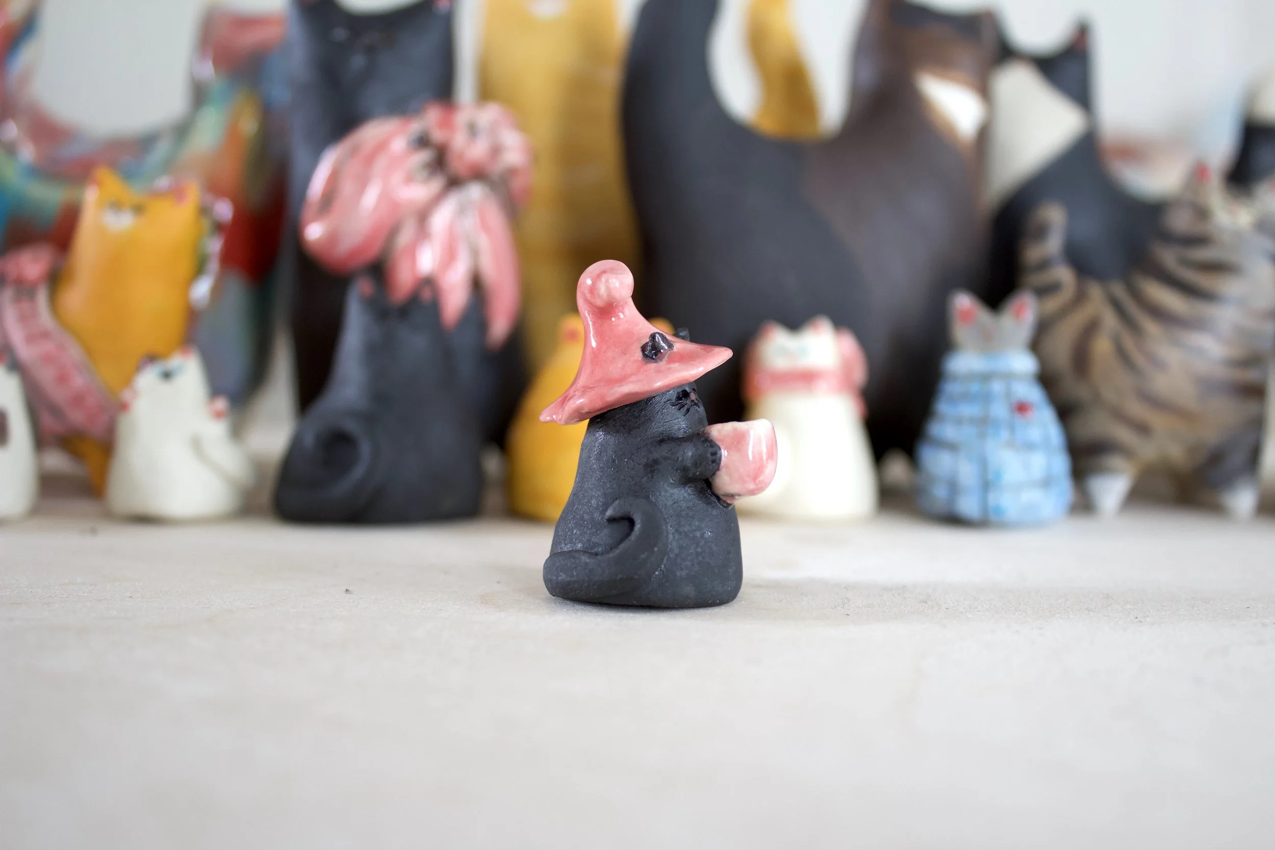 Detail view handmade void witch ceramic cat chime.jpeg