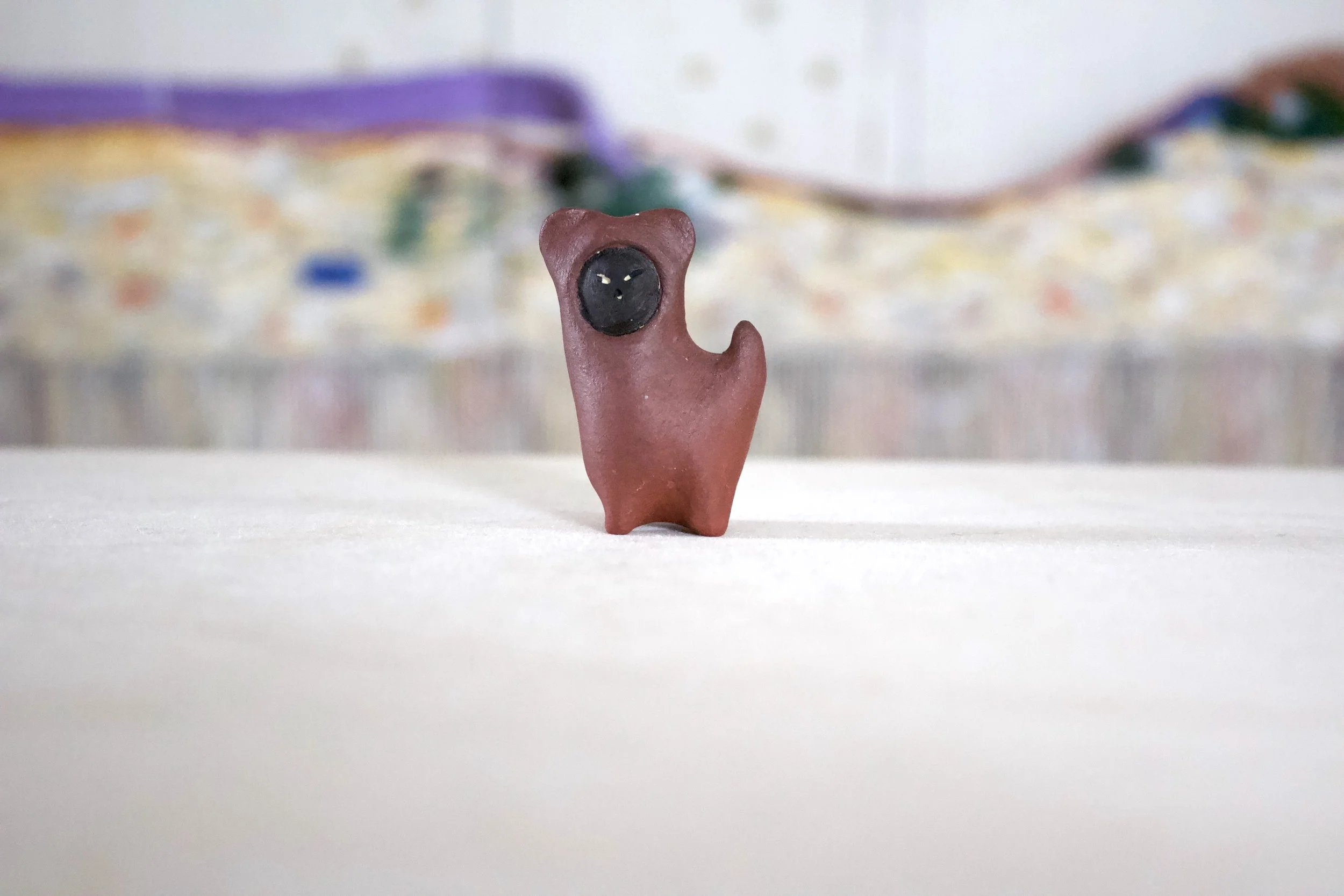 Black Cat in Brown Bear Costume - Cat Sculpture with Food Bowl