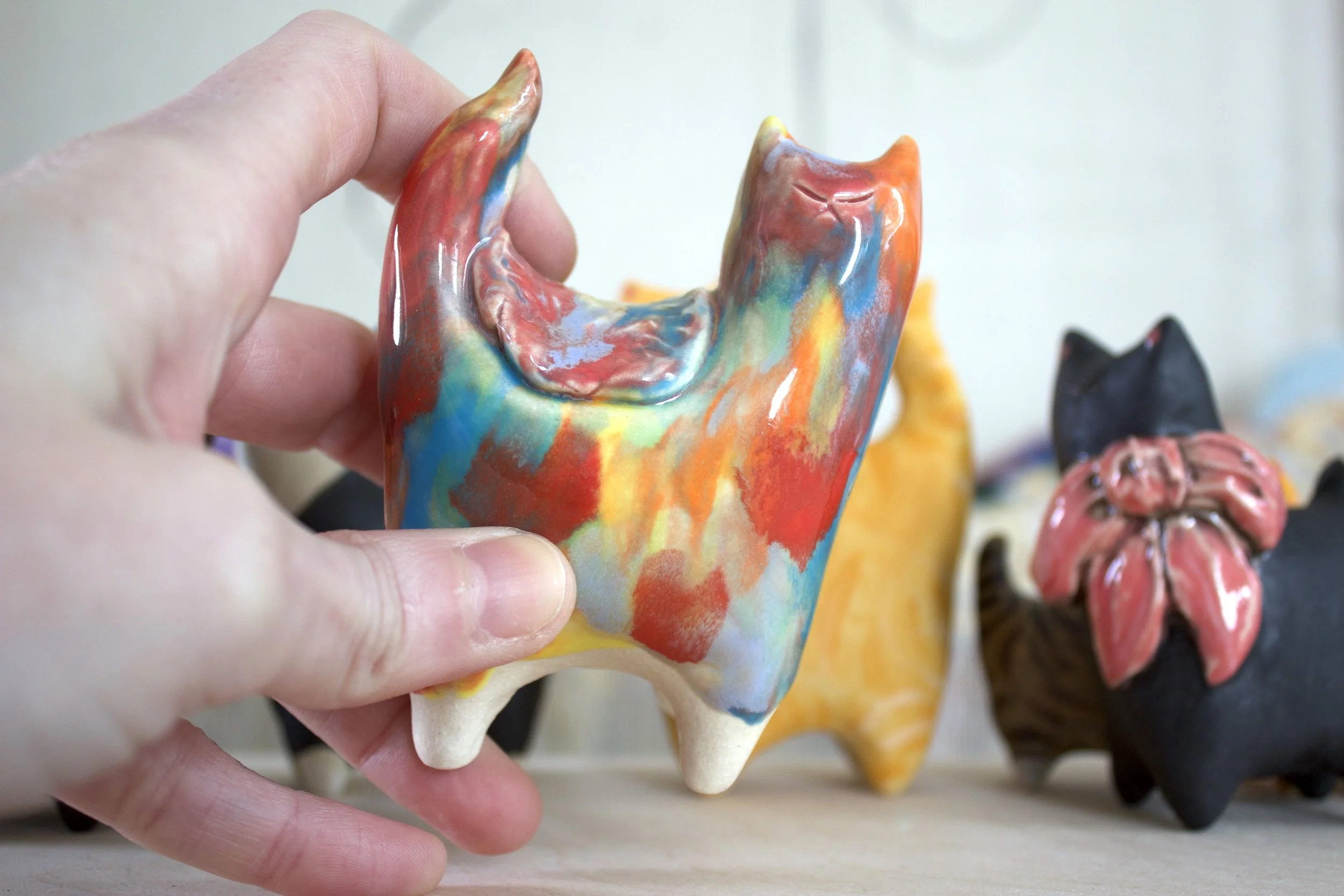 Goo Turtle ceramic sculpture shown in hand for scale.jpeg