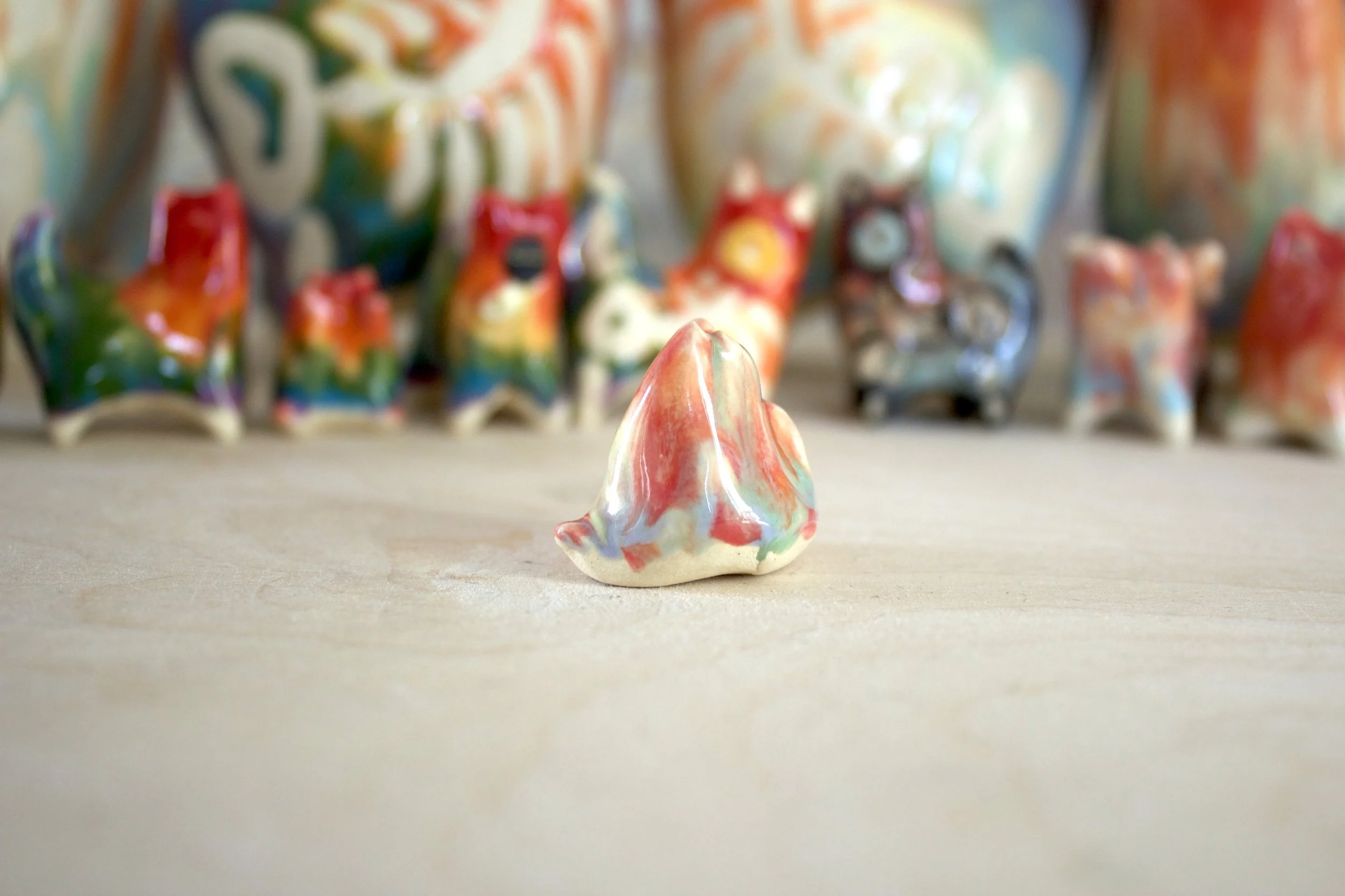 Side view of Pastel Rainbow Cat No. 1 handmade ceramic cat sculpture.jpeg