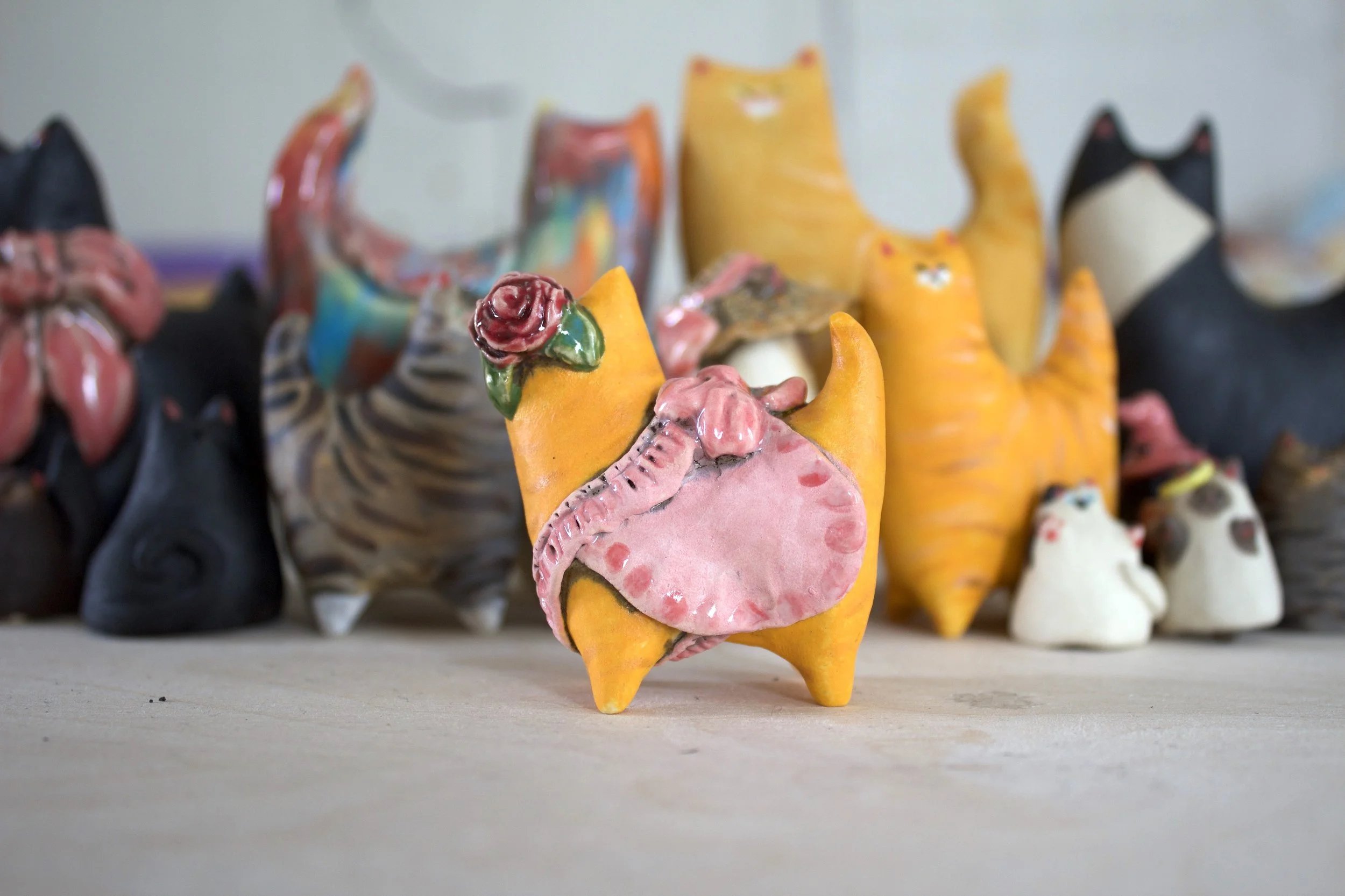 Side view Ginger Tabby ceramic cat sculpture with Rose Detail.jpeg
