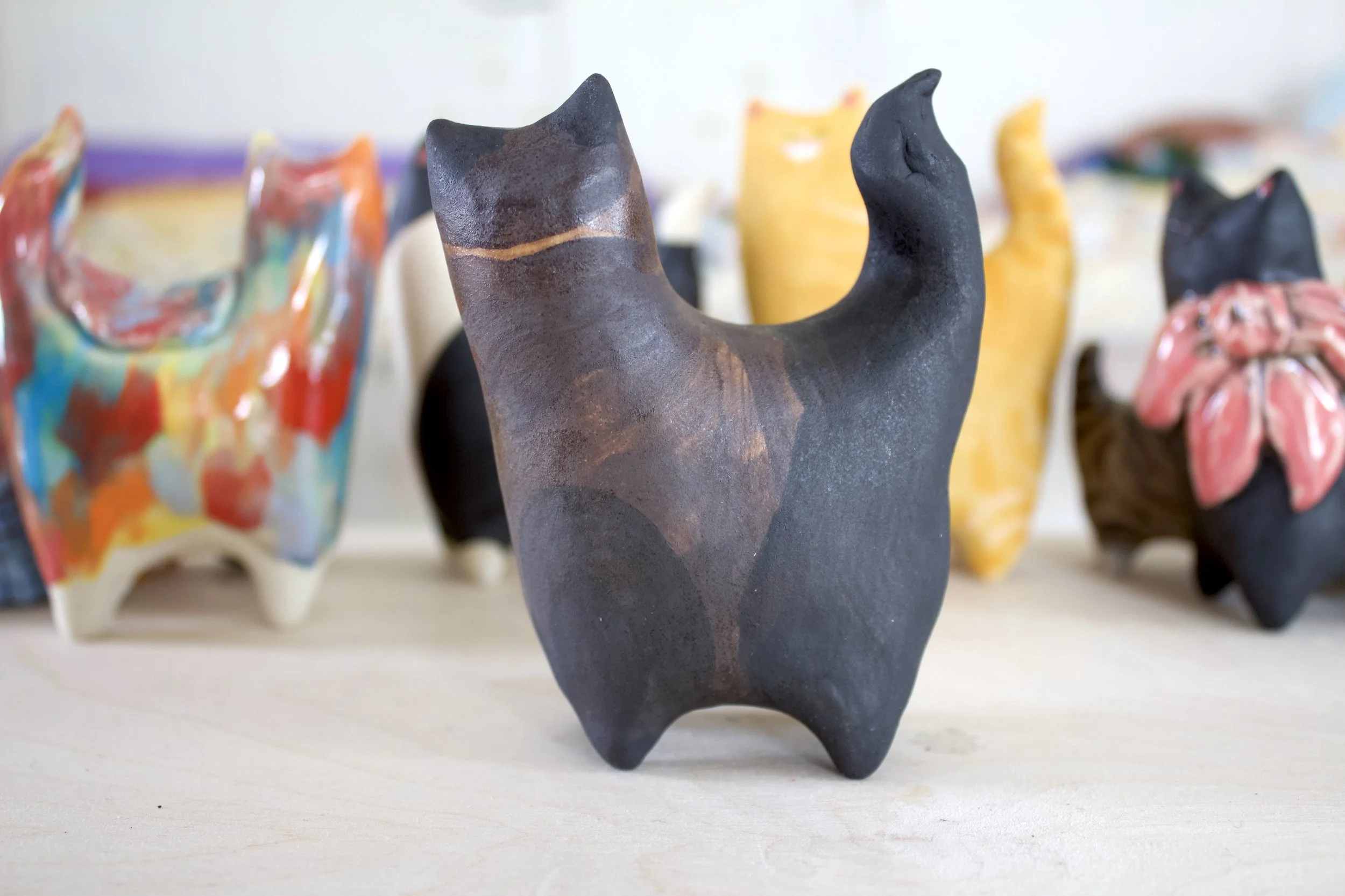 Side view Chocolate Point Siamese ceramic cat sculpture.jpeg
