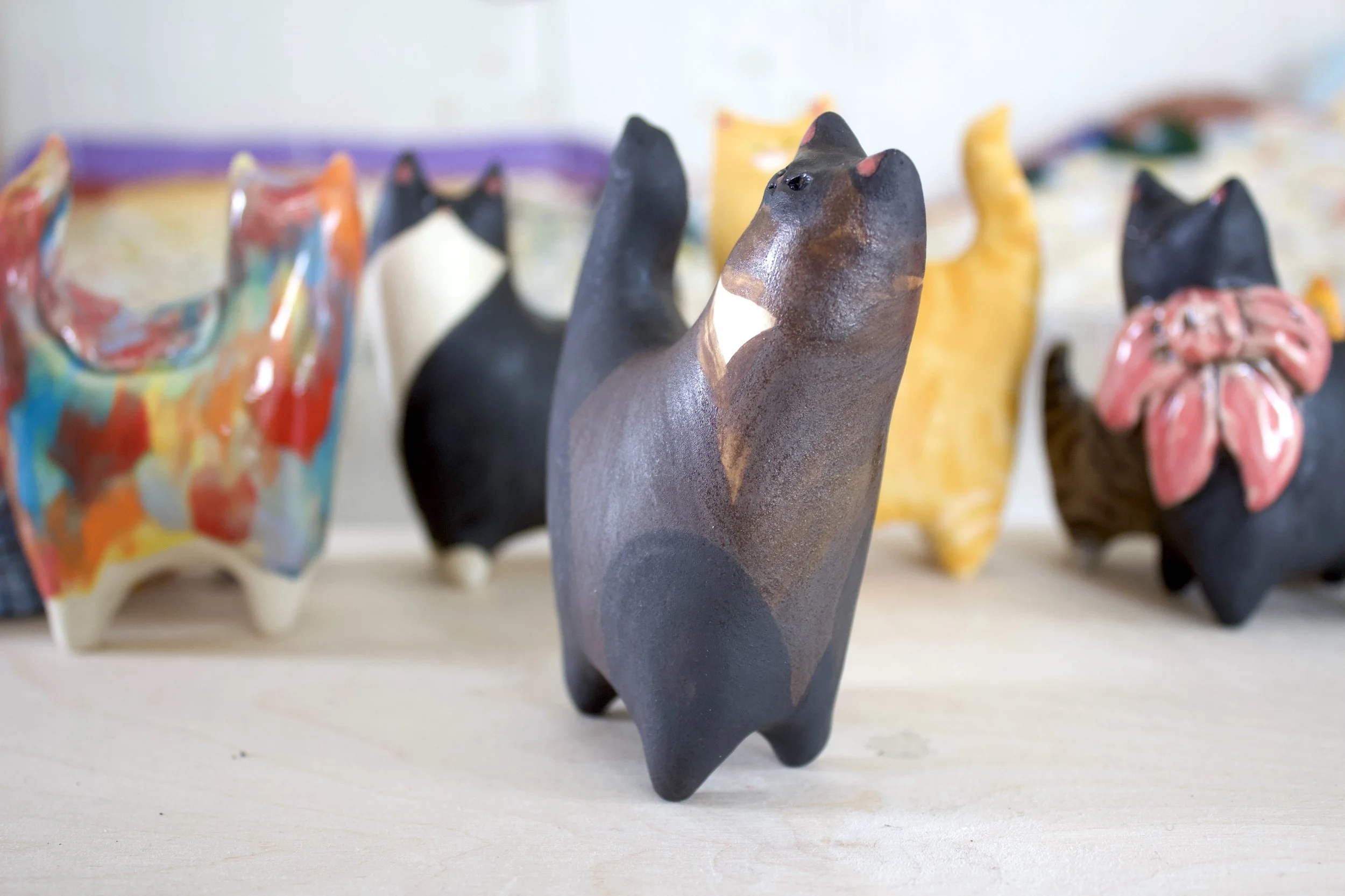 Side view Chocolate Point Siamese ceramic cat sculpture.jpeg