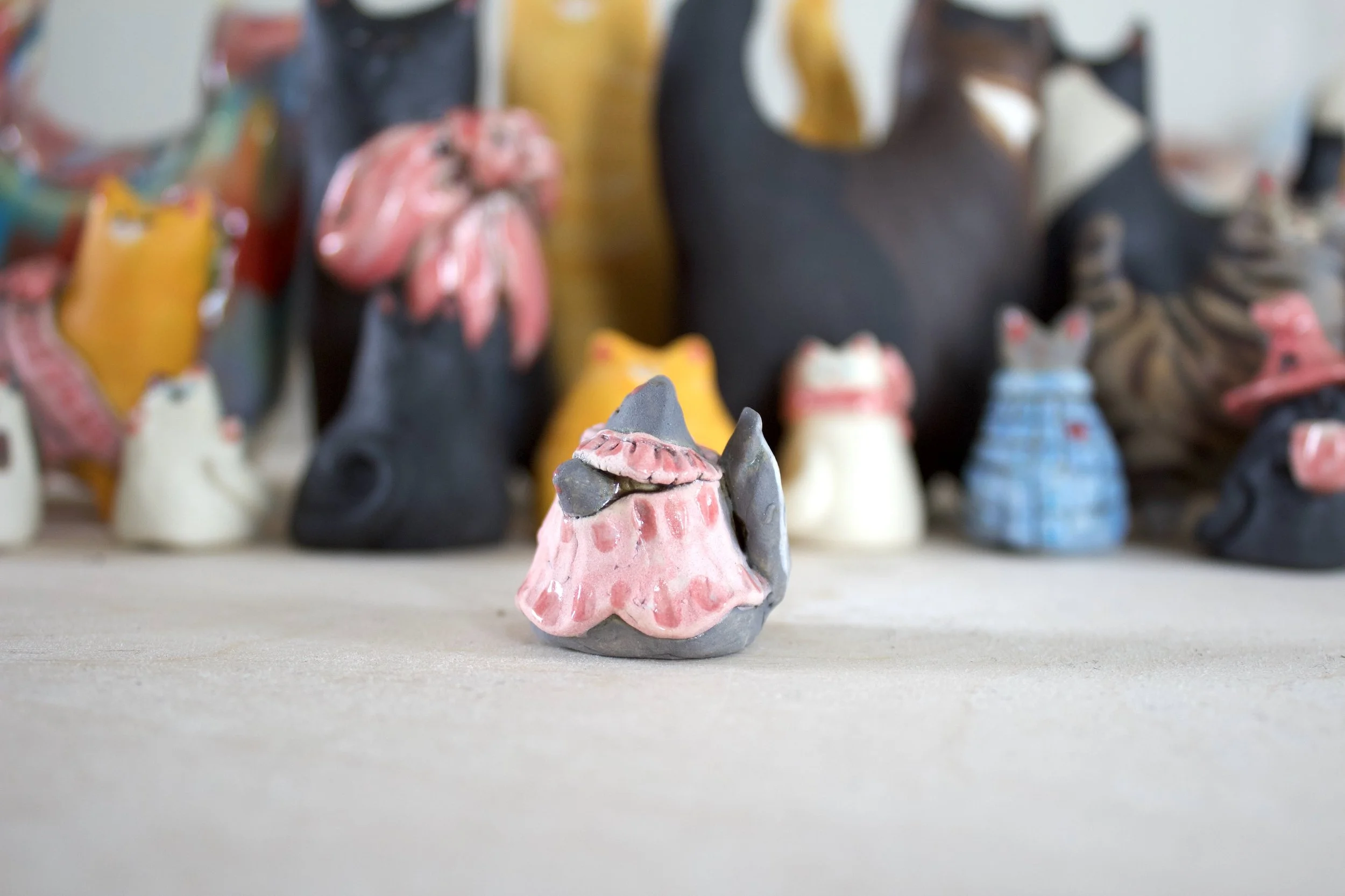 Side view gray ceramic cat chime handmade sculpture.jpeg