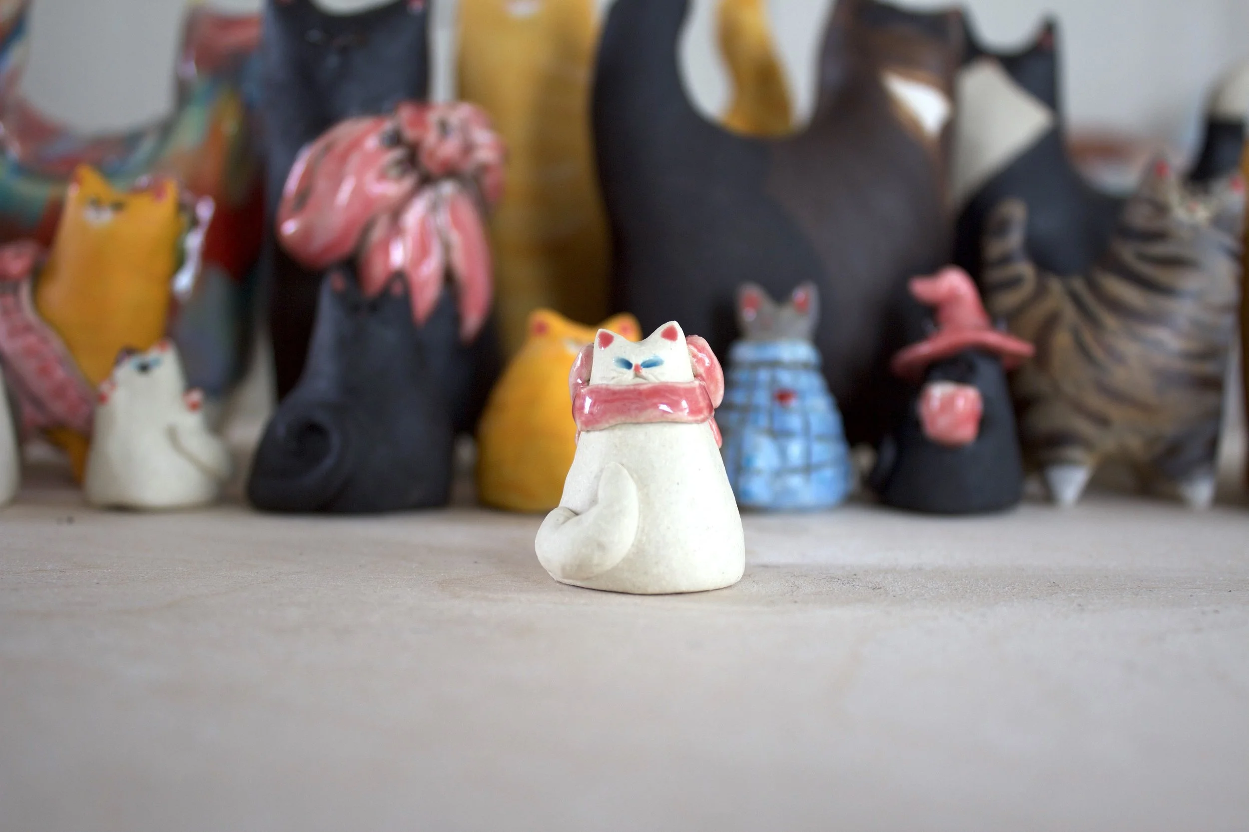 Snowball handmade white ceramic cat chime with pink bow.jpeg