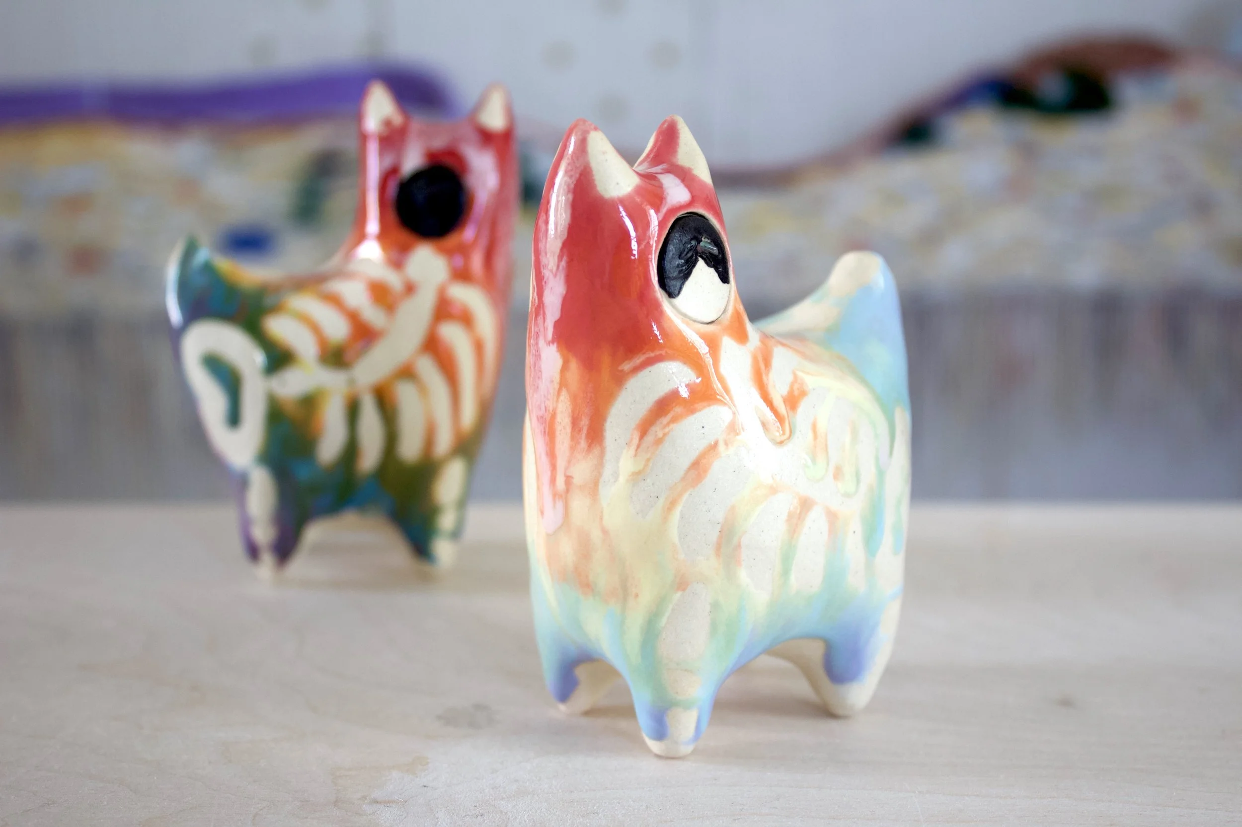 One-of-a-kind handmade large ceramic Pastel Rainbow Goo Skeleton Cat viewed from the front.jpeg