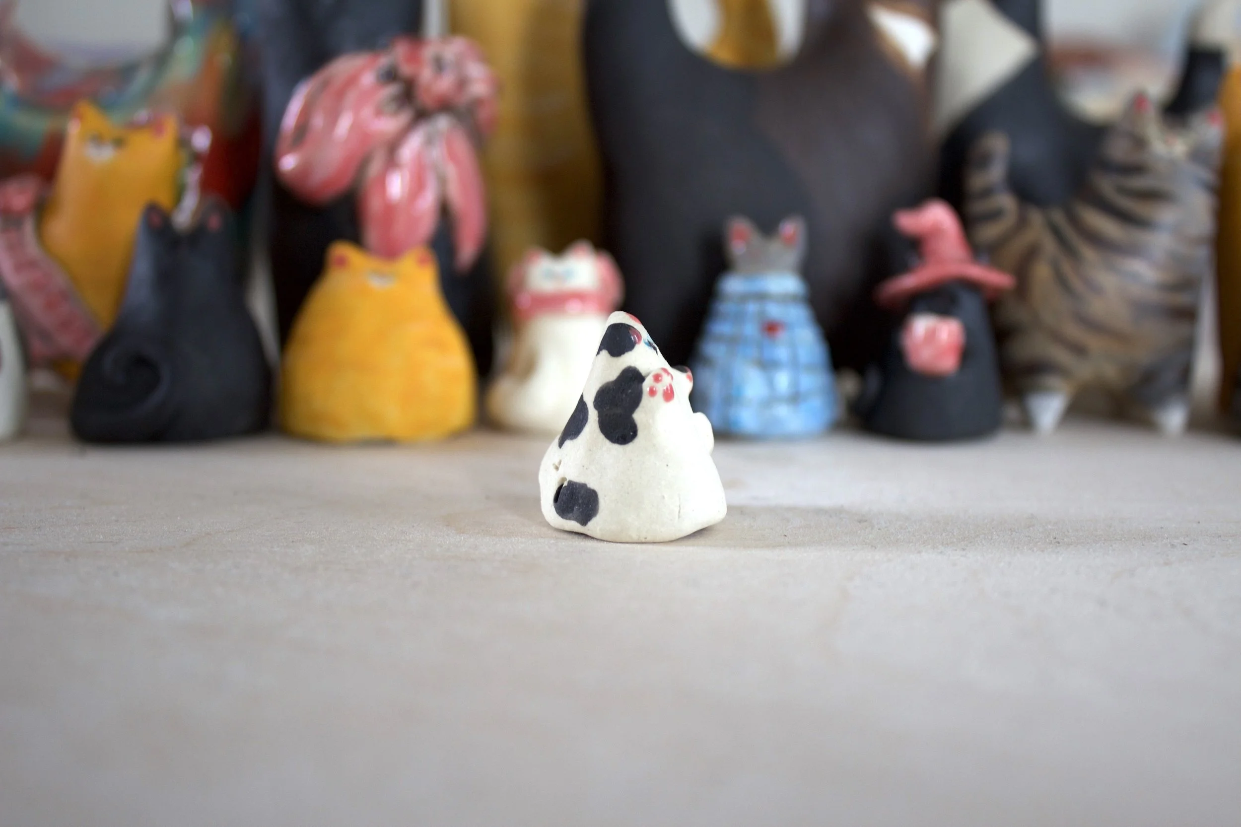 Piebald ceramic cat chime handmade sculpture detail.jpeg