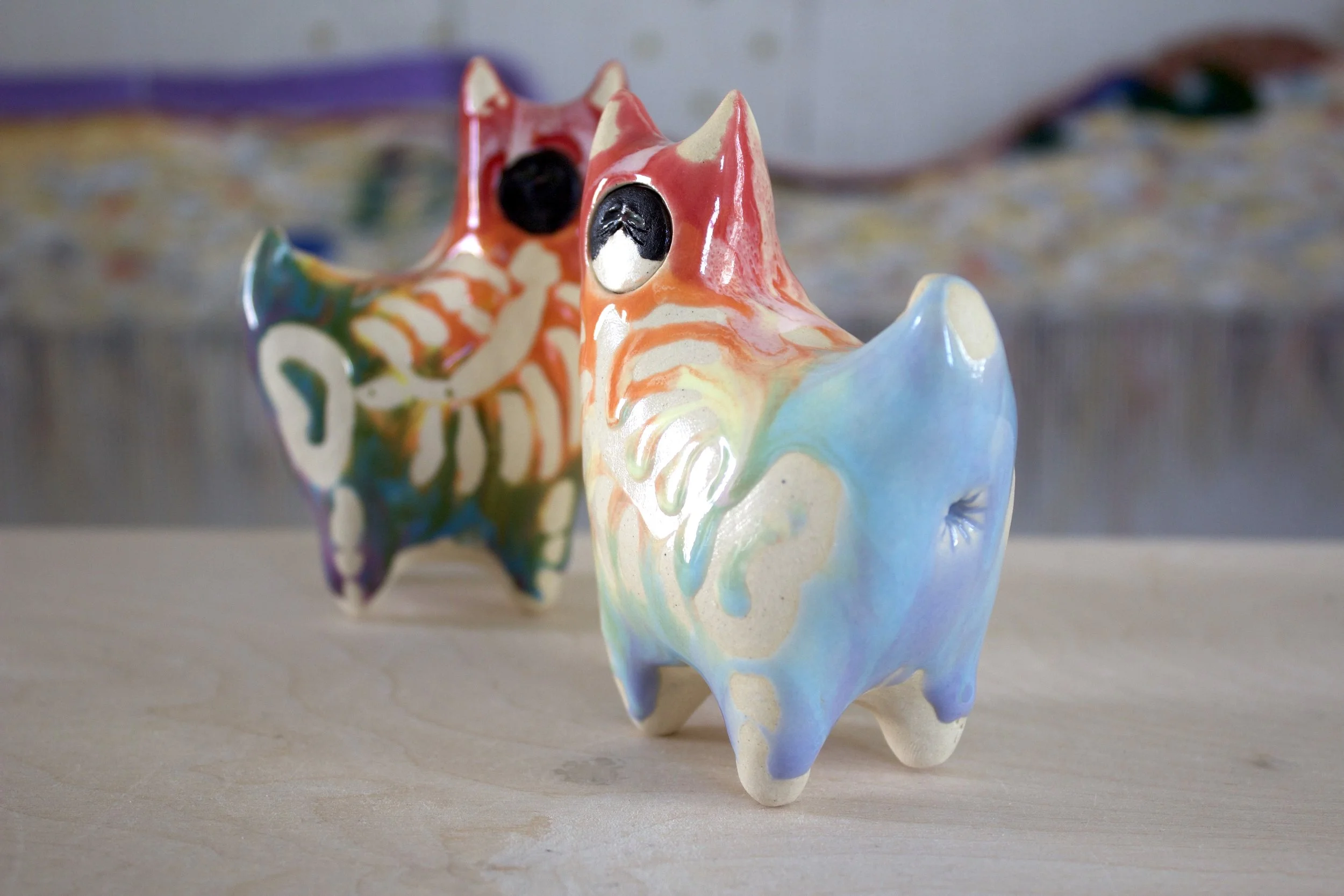 One-of-a-kind handmade large ceramic Pastel Rainbow Goo Skeleton Cat viewed from the front.jpeg