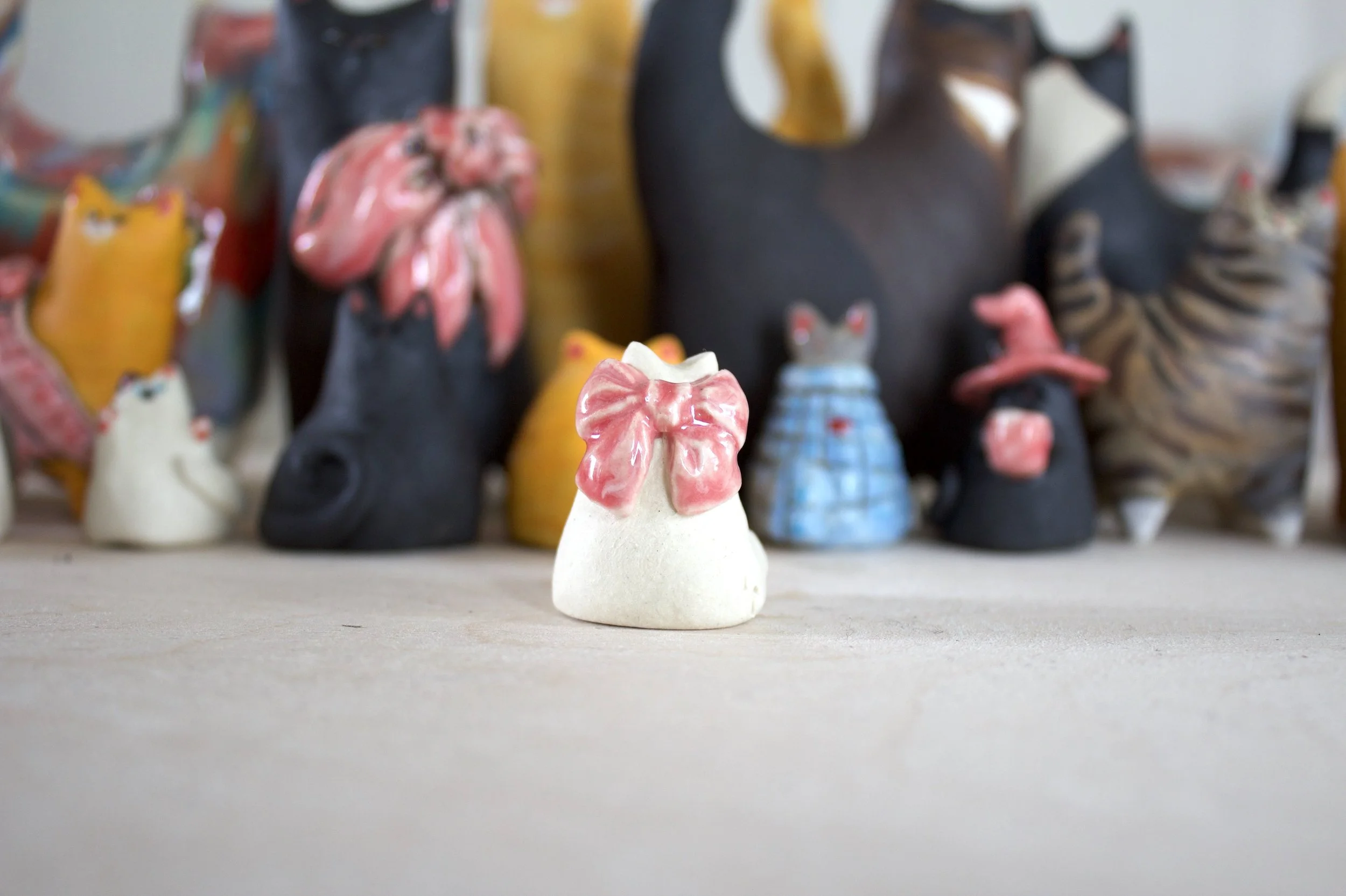 Back view handmade Snowball ceramic cat chime.jpeg