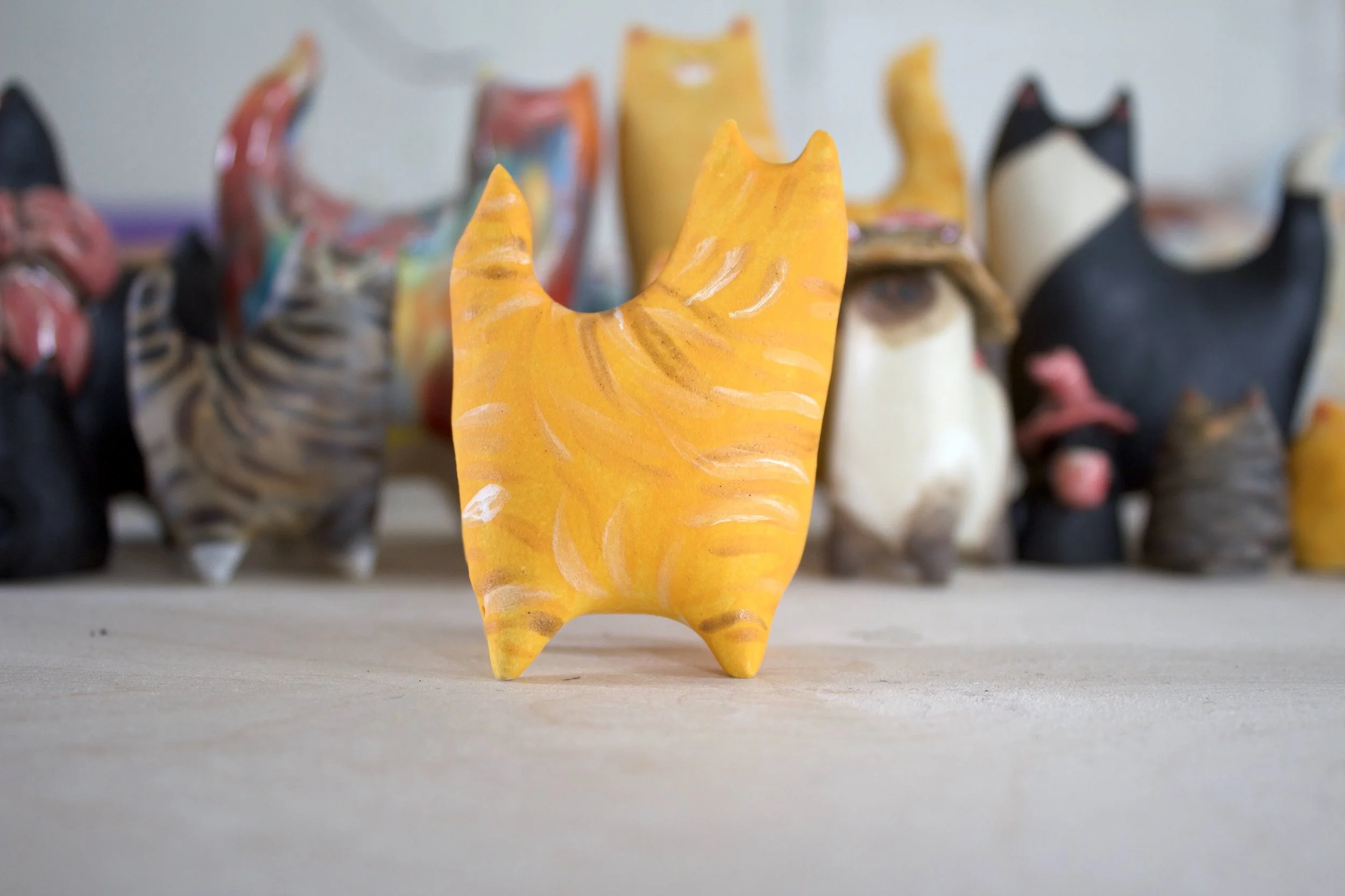Side view ginger tabby ceramic cat sculpture.jpeg