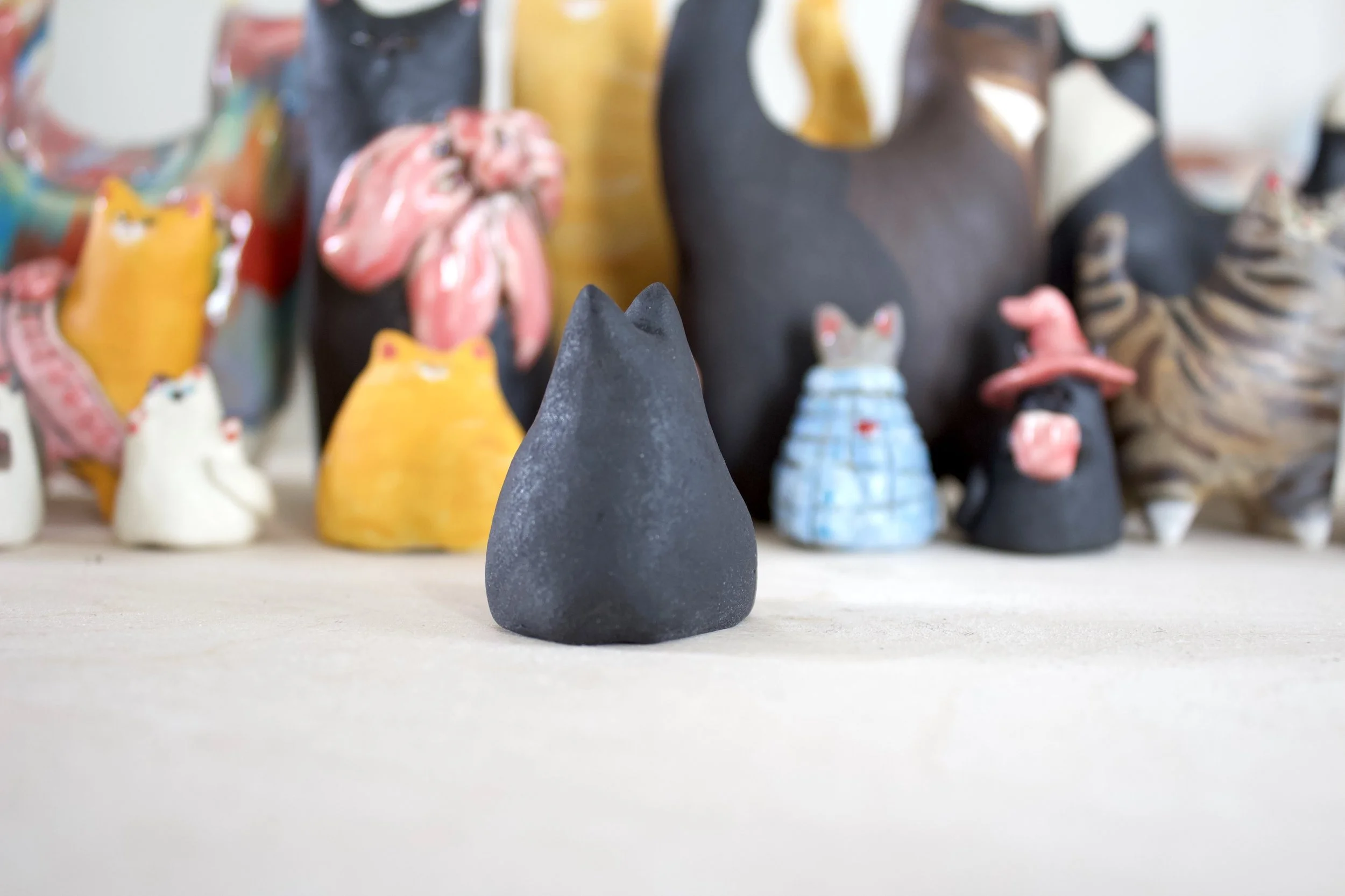 Side view void ceramic cat chime handmade sculpture.jpeg