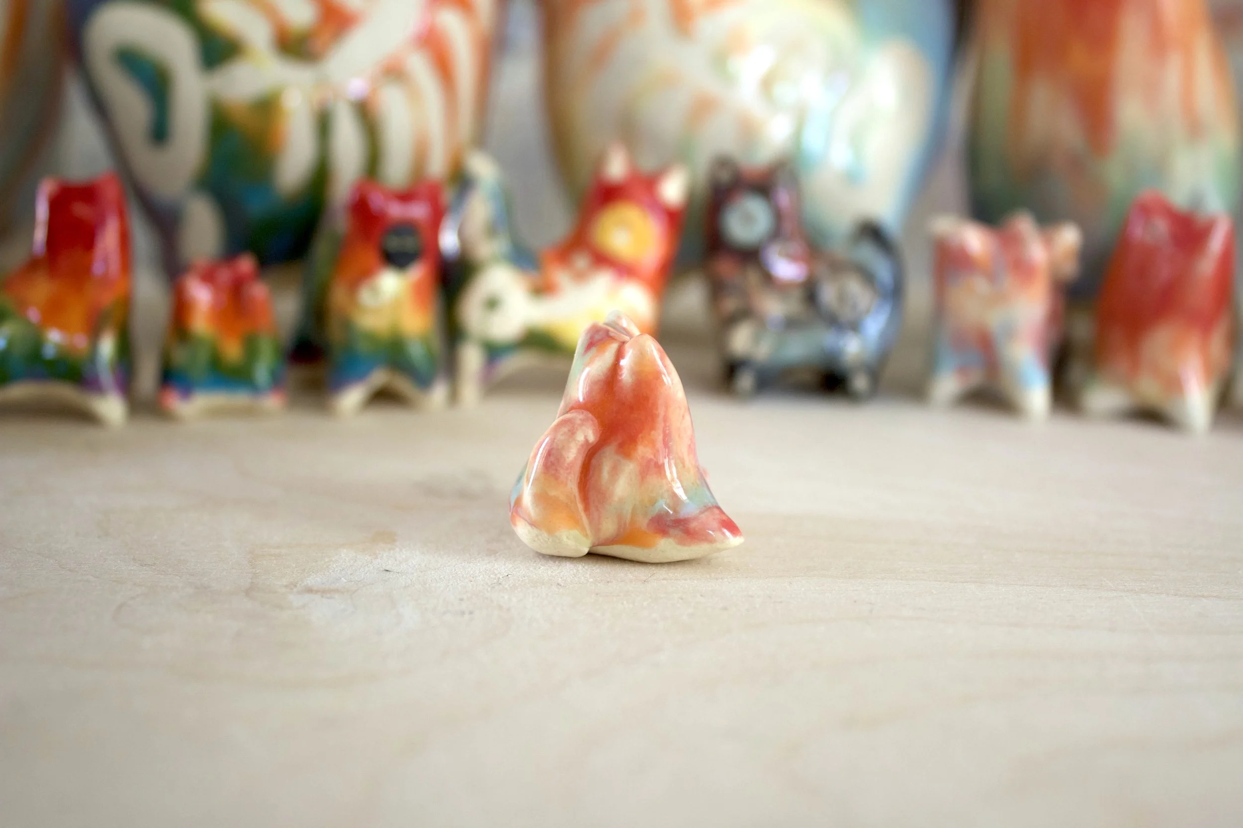 Side view of Pastel Rainbow Cat No. 1 handmade ceramic cat sculpture.jpeg