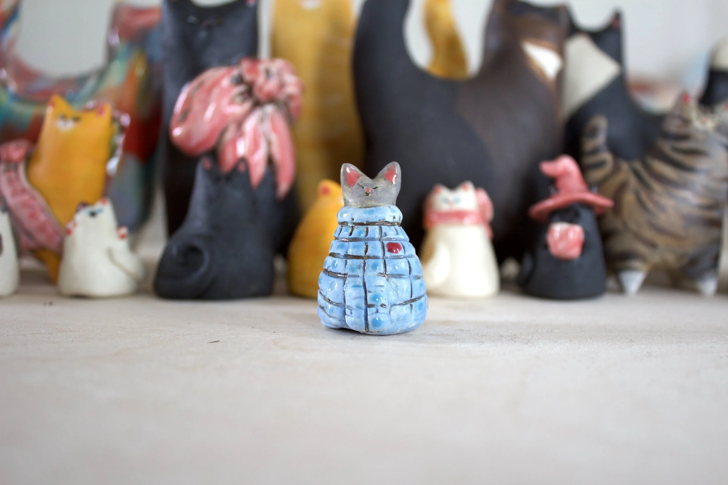 Sphynx handmade ceramic cat chime in blue sweater with red heart.jpeg