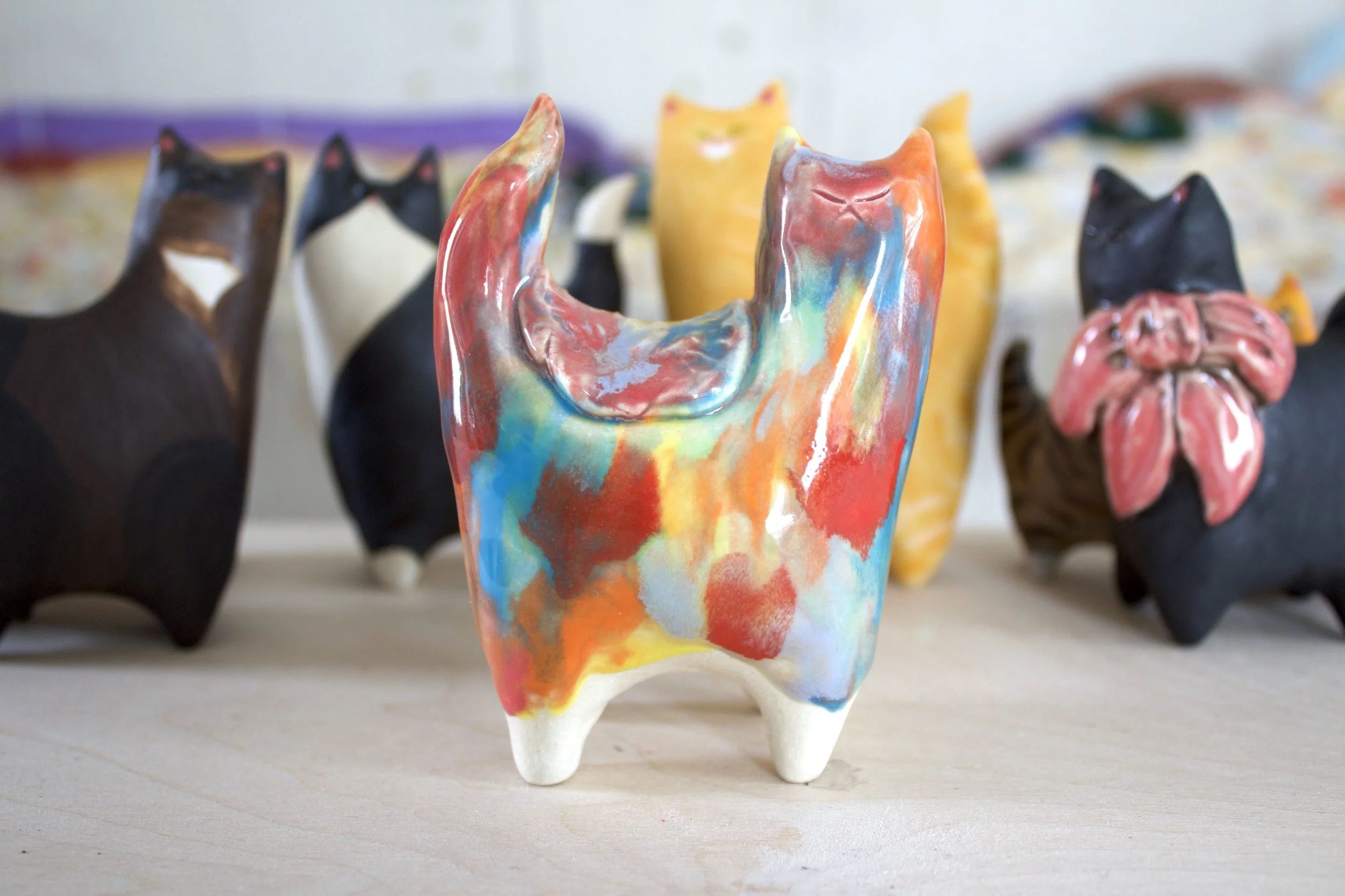 Goo Turtle handmade ceramic sculpture with colorful drippy melting details and red hearts.jpeg