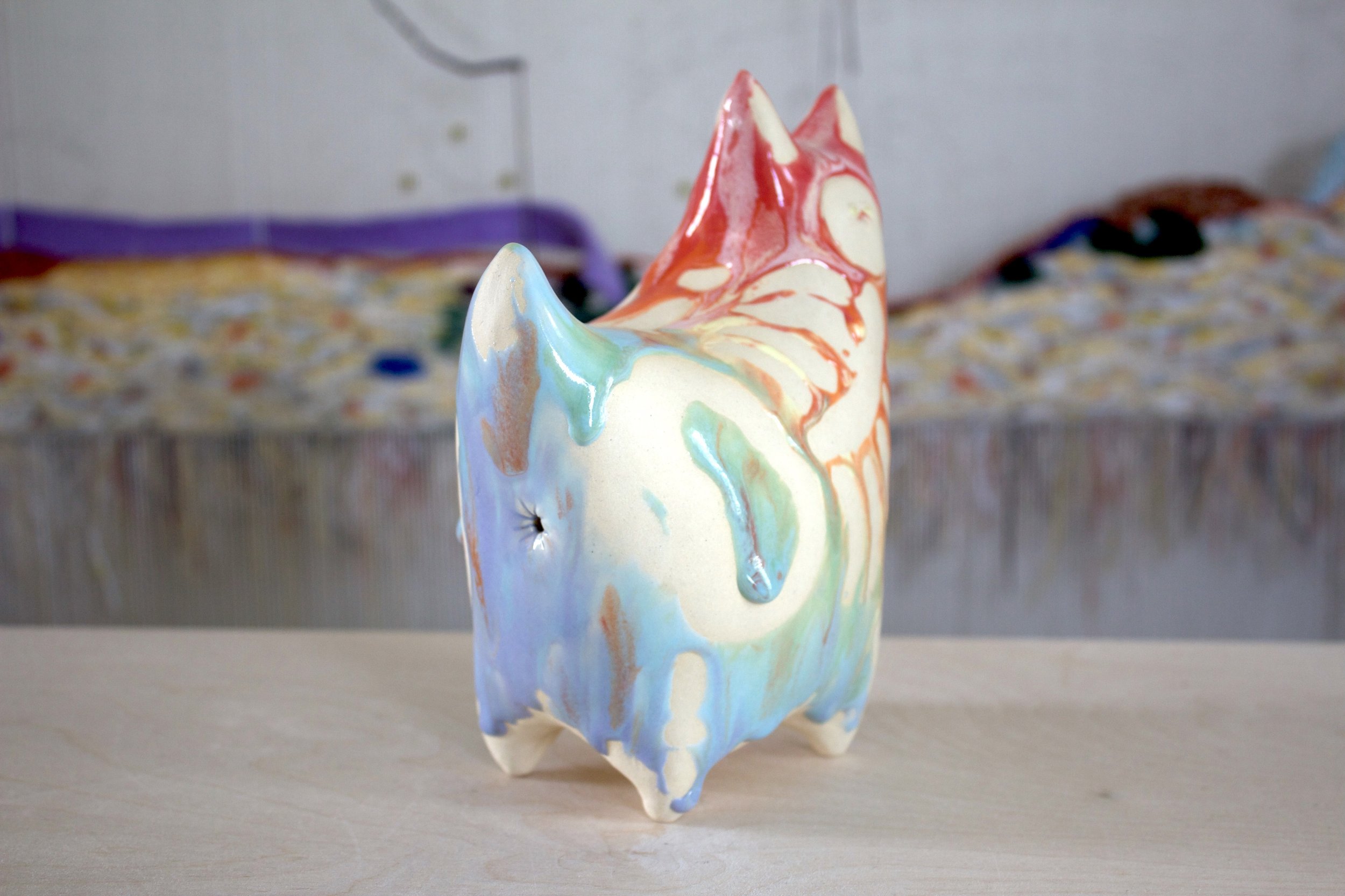 Three-quarter view of the XL Collector Pastel Goo Skeleton White Cat, a handmade ceramic cat sculpture.jpeg