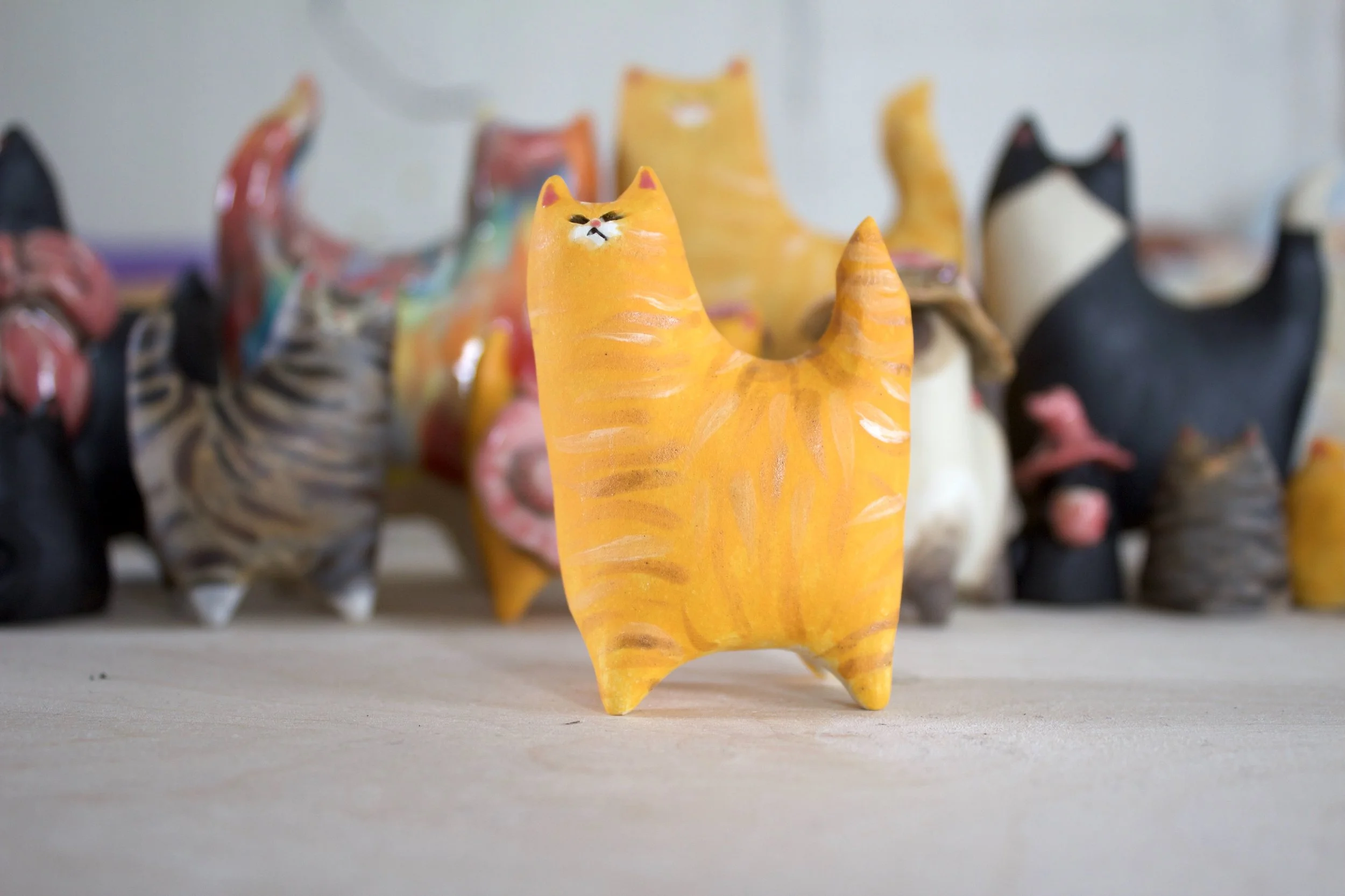 Orange tabby handmade ceramic cat sculpture.jpeg