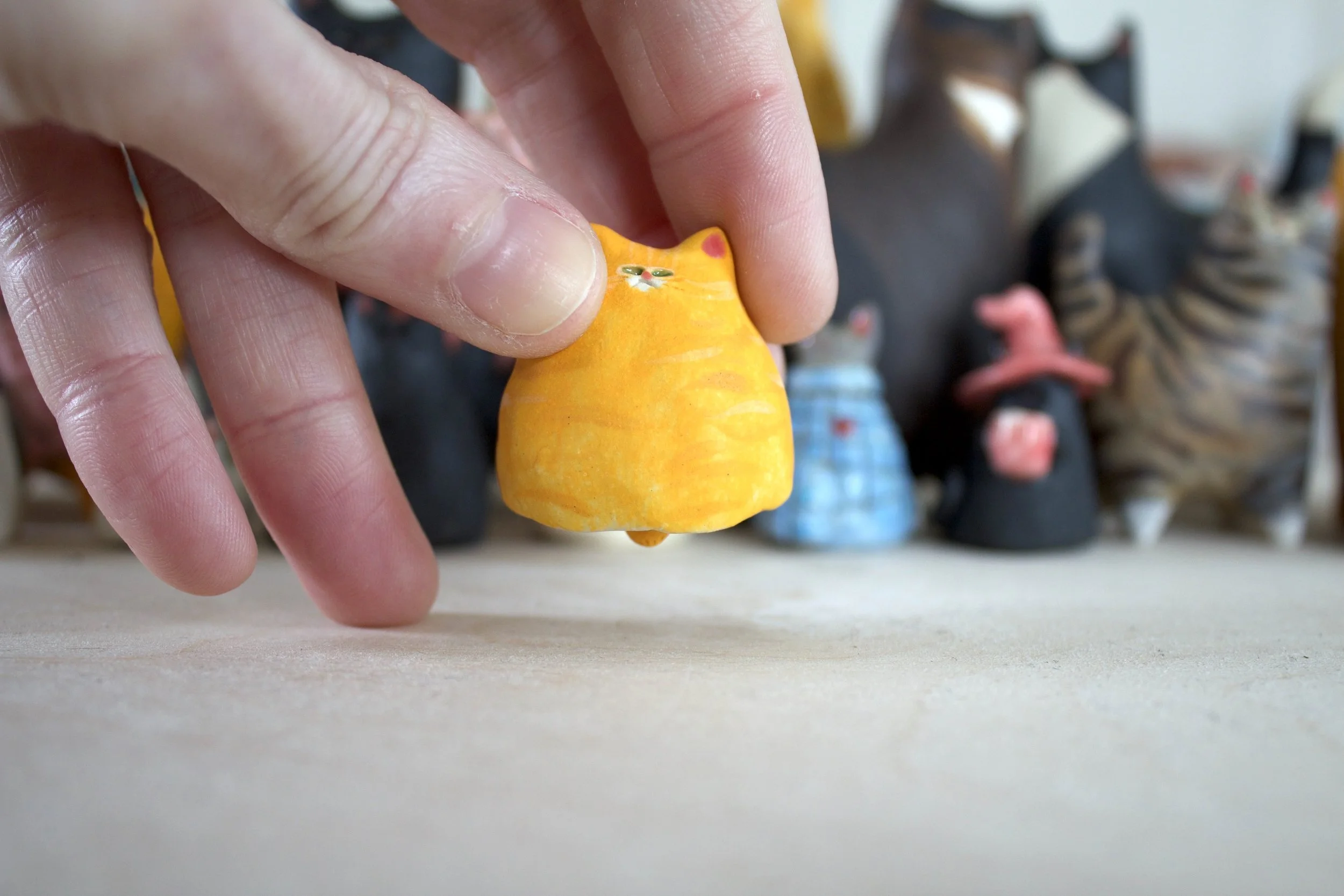 Orange tabby ceramic cat chime.jpeg