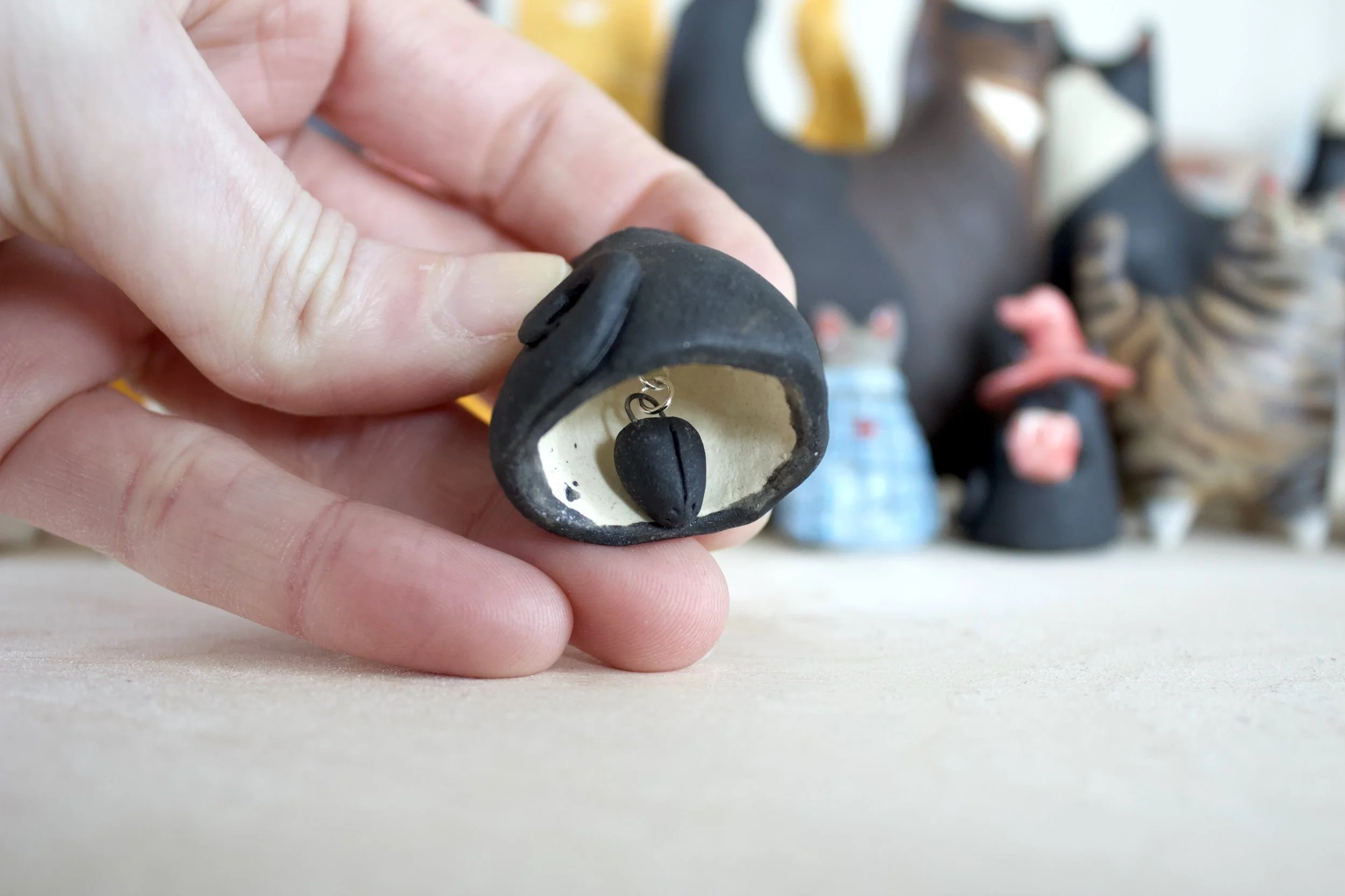 Void ceramic cat chime paw clapper detail.jpeg