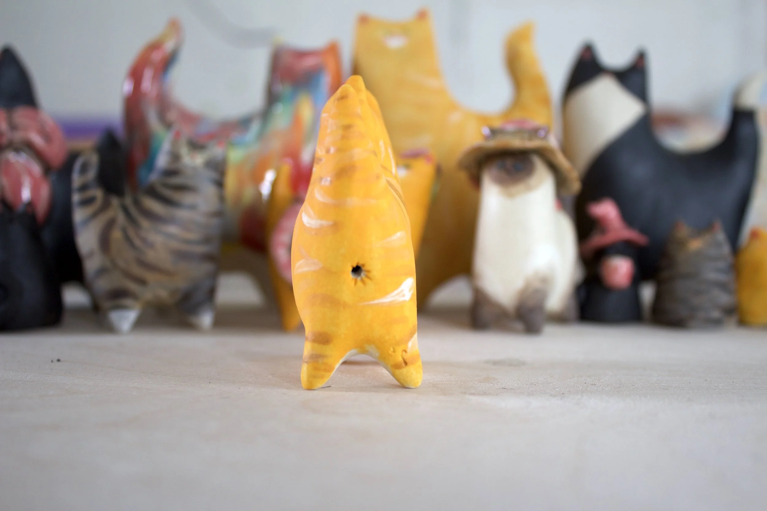 Back view orange tabby handmade ceramic cat sculpture.jpeg