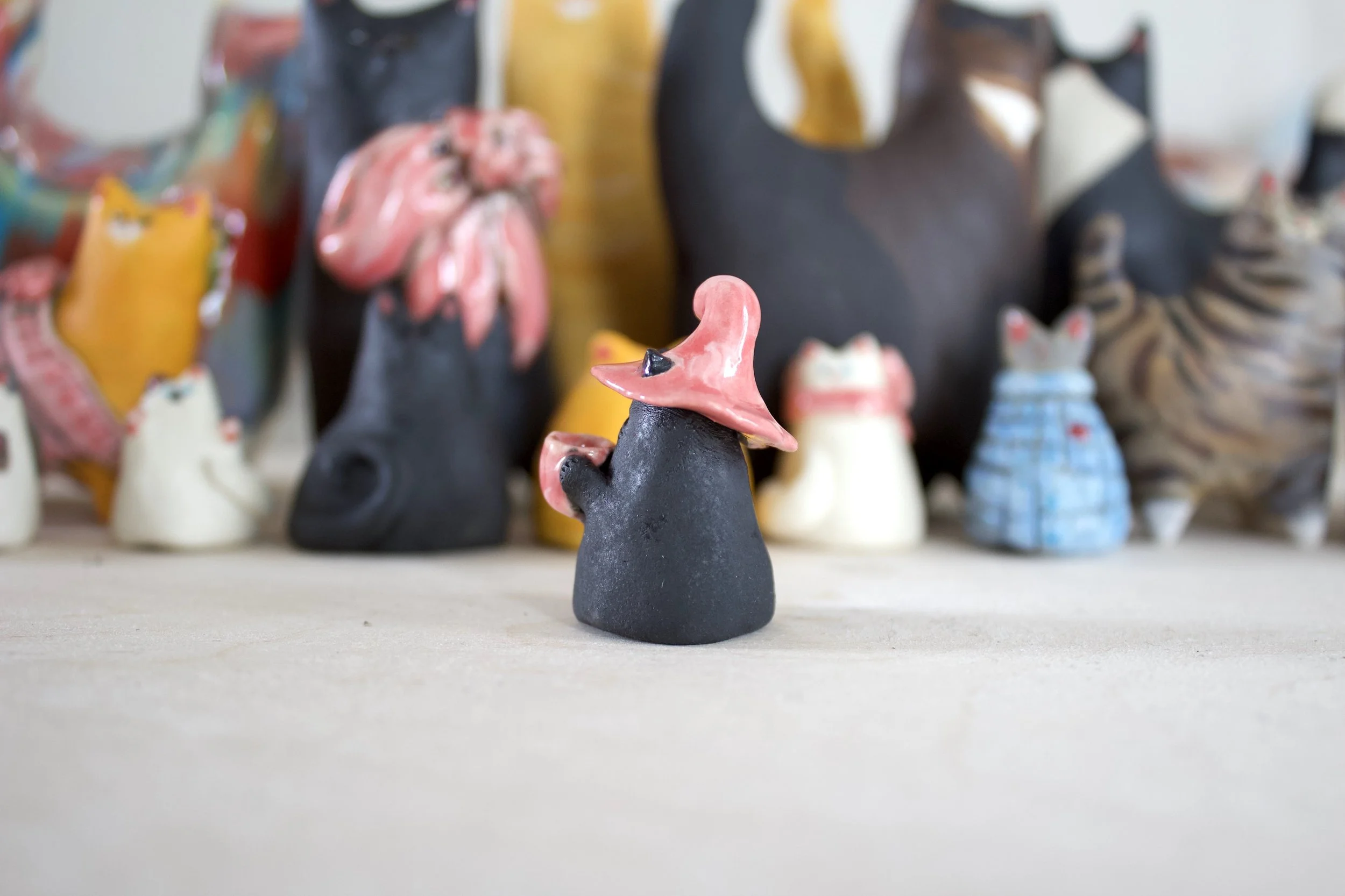 Side view void witch ceramic cat chime handmade sculpture.jpeg
