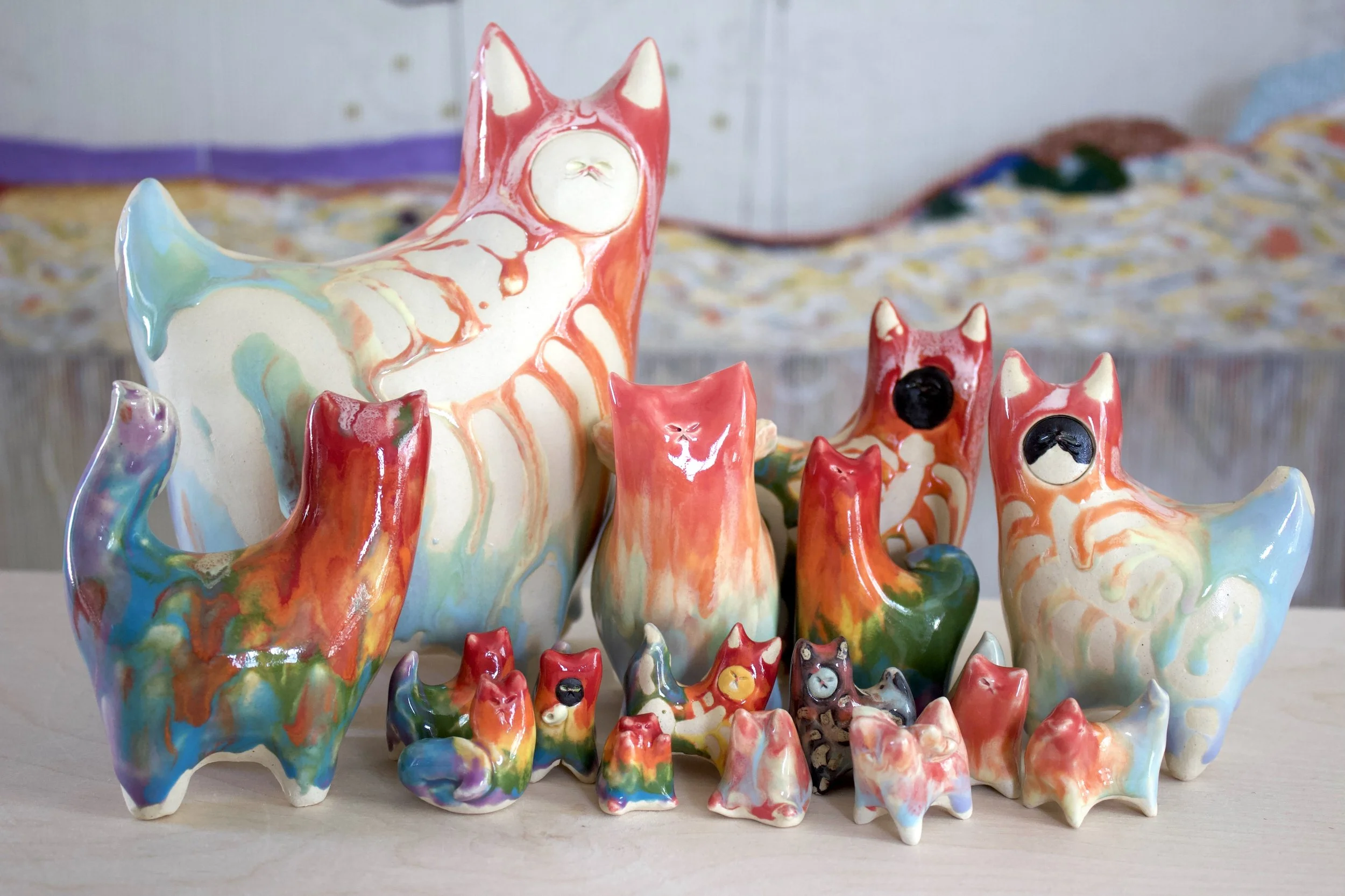 Rainbow Goo Collection featuring one-of-a-kind handmade ceramic cat sculptures in bright and pastel rainbow colors.jpeg