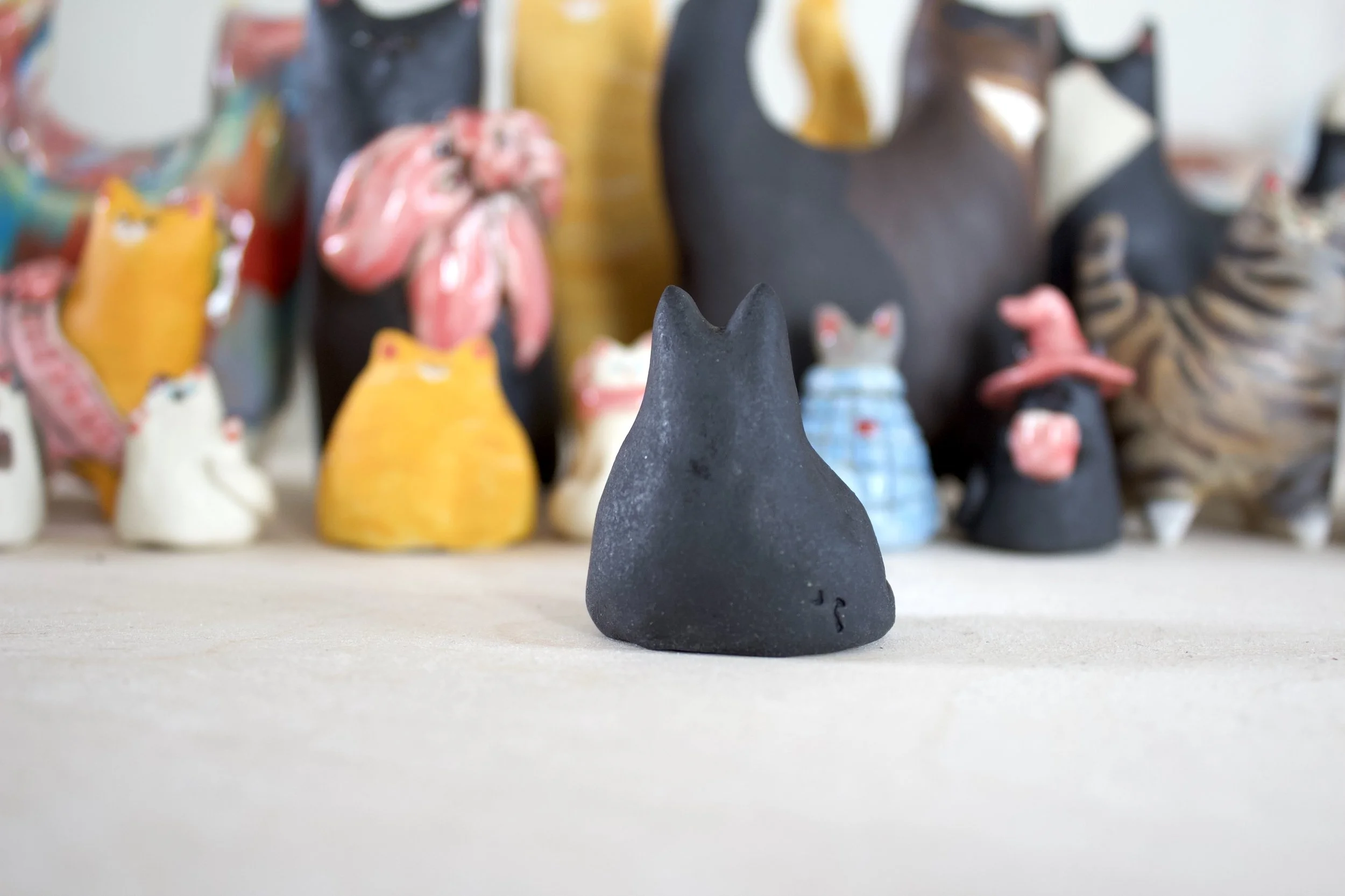 Black ceramic cat chime handmade sculpture detail.jpeg