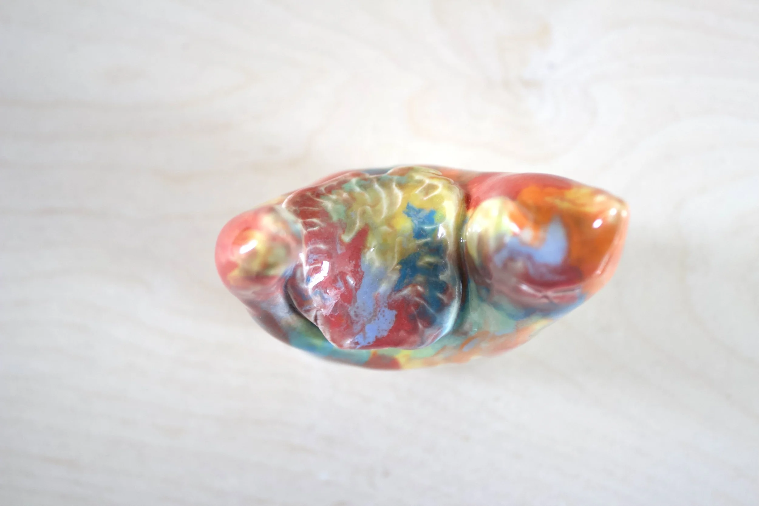 Top view Goo Turtle ceramic sculpture showing colorful melting details.jpeg