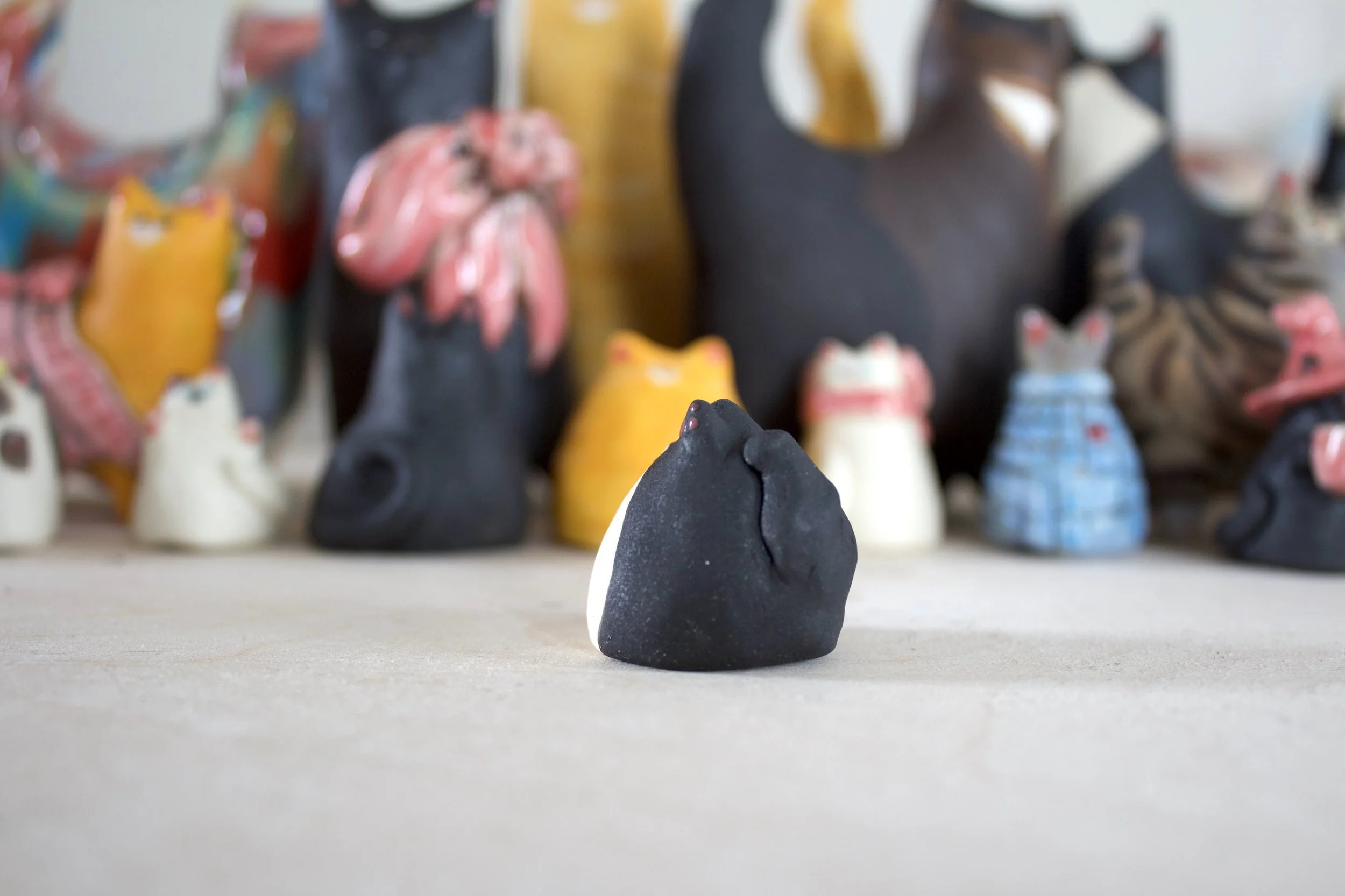 Side view Tuxedo ceramic cat chime handmade sculpture.jpeg