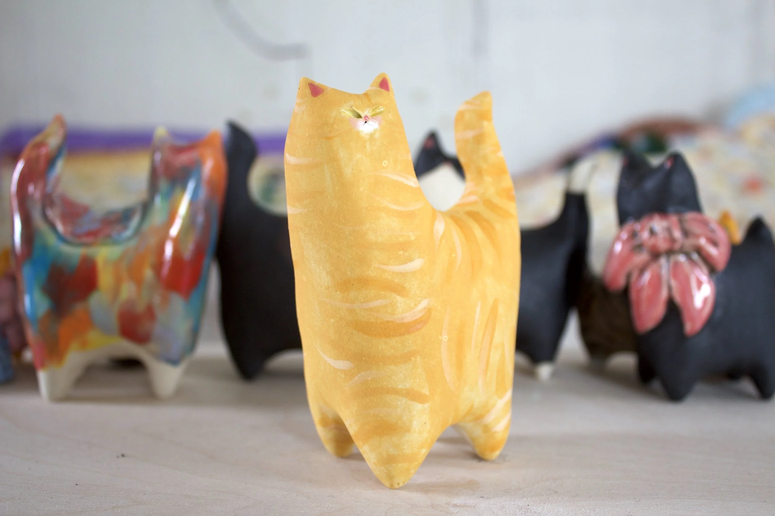 Side view Orange Tabby ceramic cat sculpture.jpeg