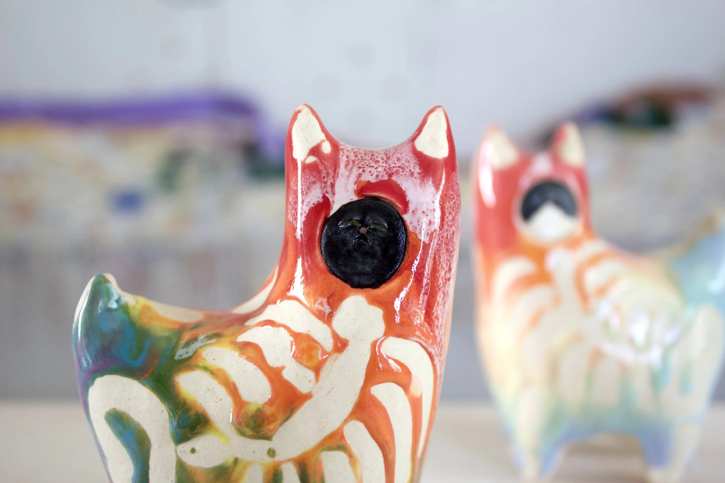Detail view of the large Rainbow Goo Skeleton Black Cat showing sculpted rainbow goo and skeleton details.jpeg