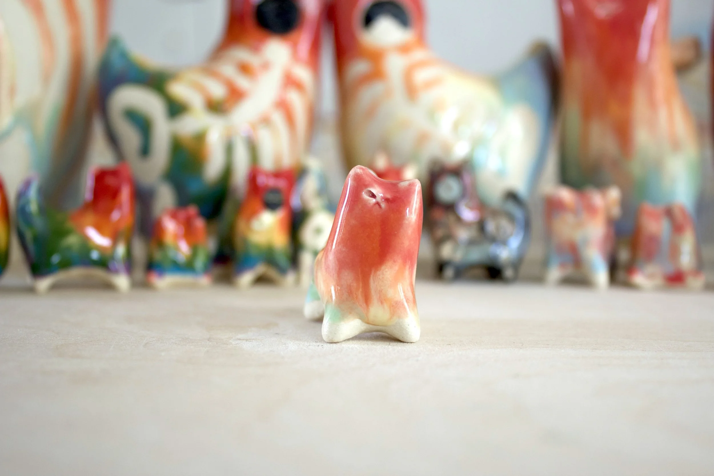 One-of-a-kind handmade ceramic Pastel Rainbow Cat No. 2 viewed from the front.jpeg