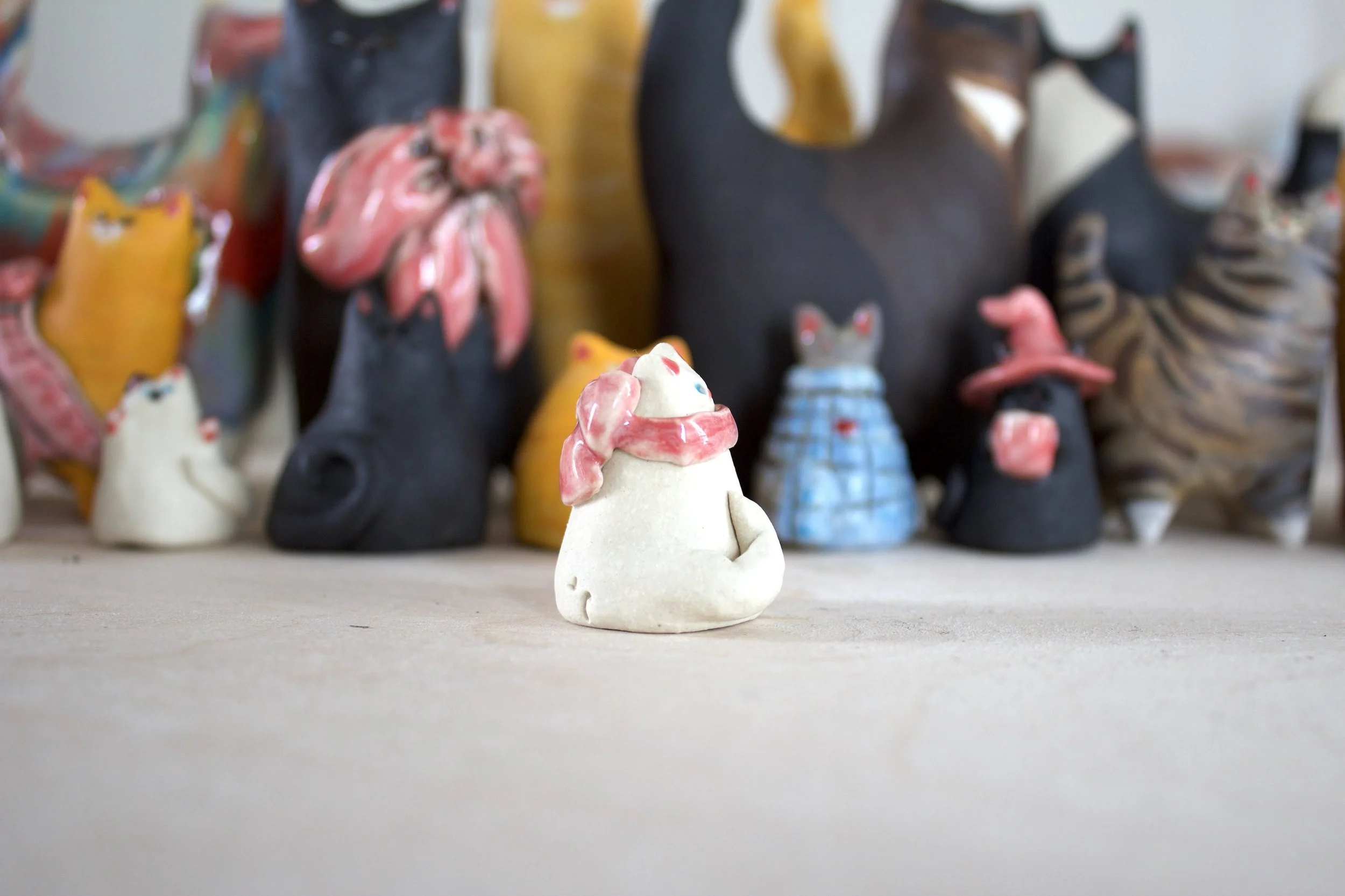 White ceramic cat chime handmade sculpture detail.jpeg