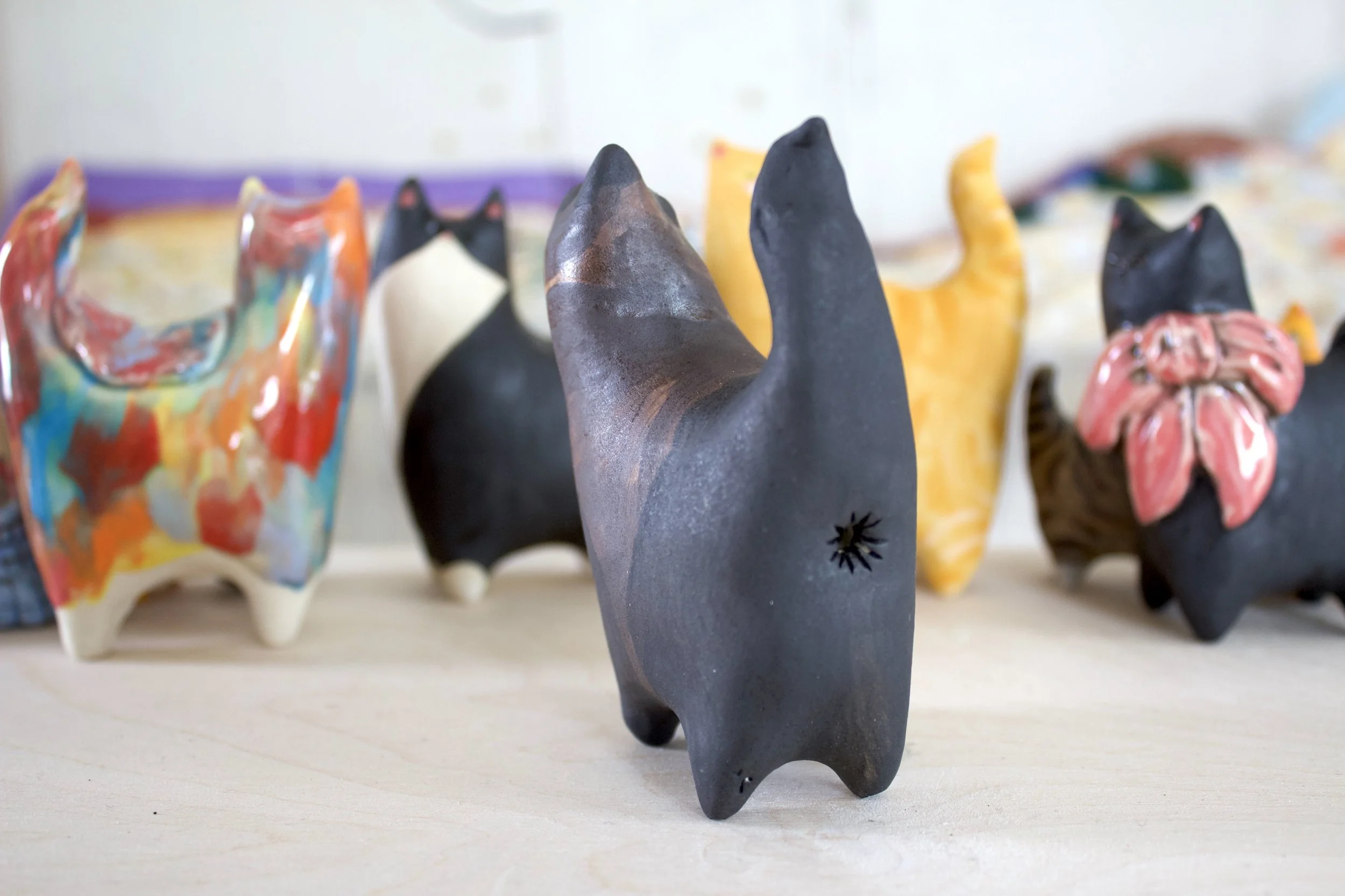 Side view Chocolate Point Siamese ceramic cat sculpture.jpeg